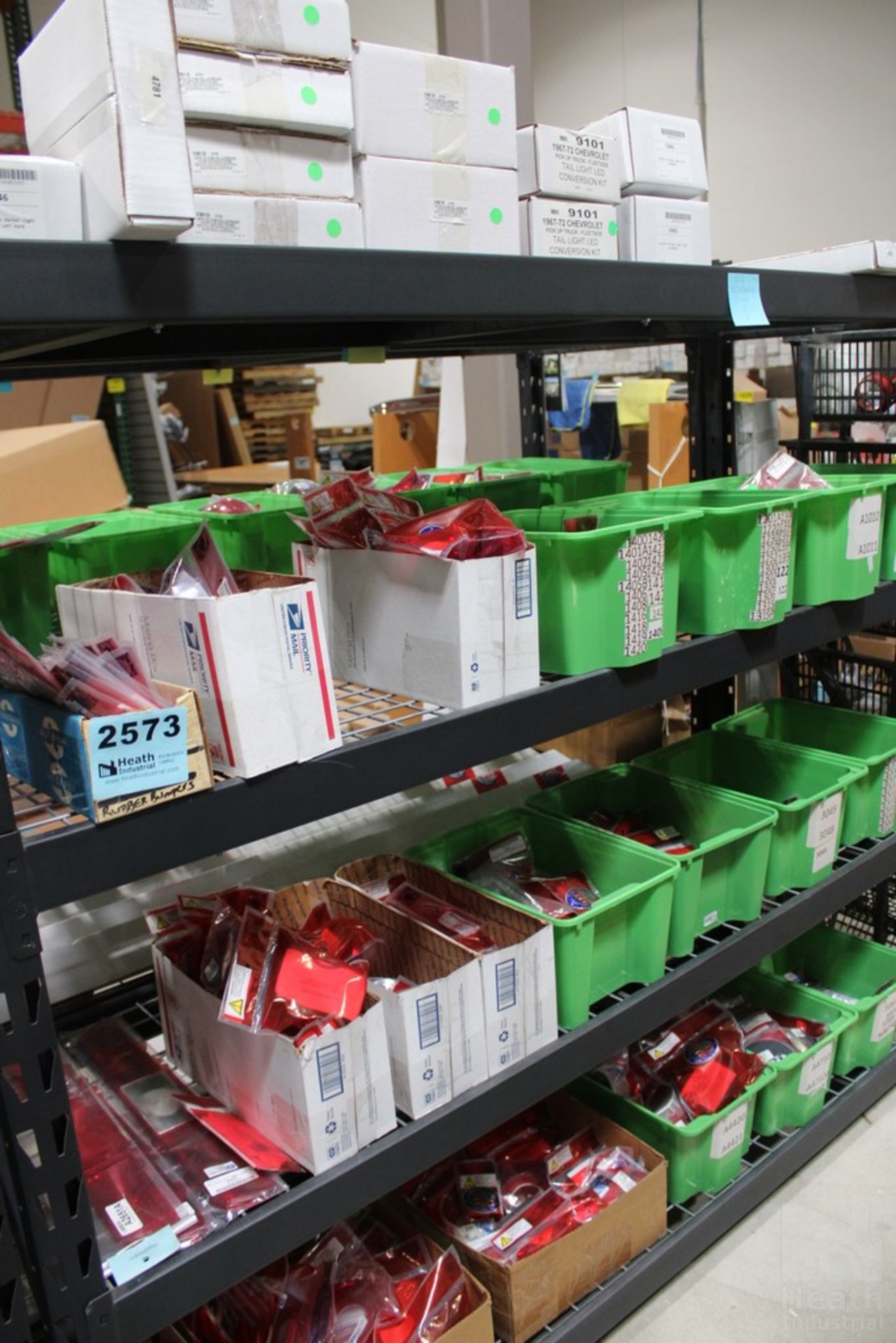 TRIM PARTS ON THREE SHELVES, INCLUDING 1967-1972 CHEVY PICKUP TAIL LIGHT LED CONVERSION KIT, 1957