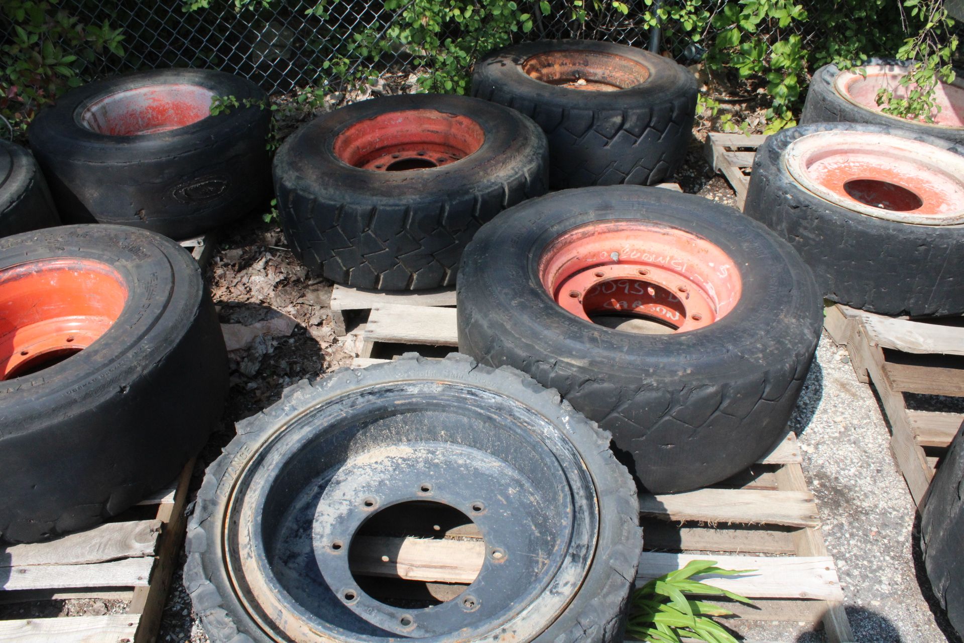 (4) SKID STEER TIRES WITH RIMS - Image 2 of 3