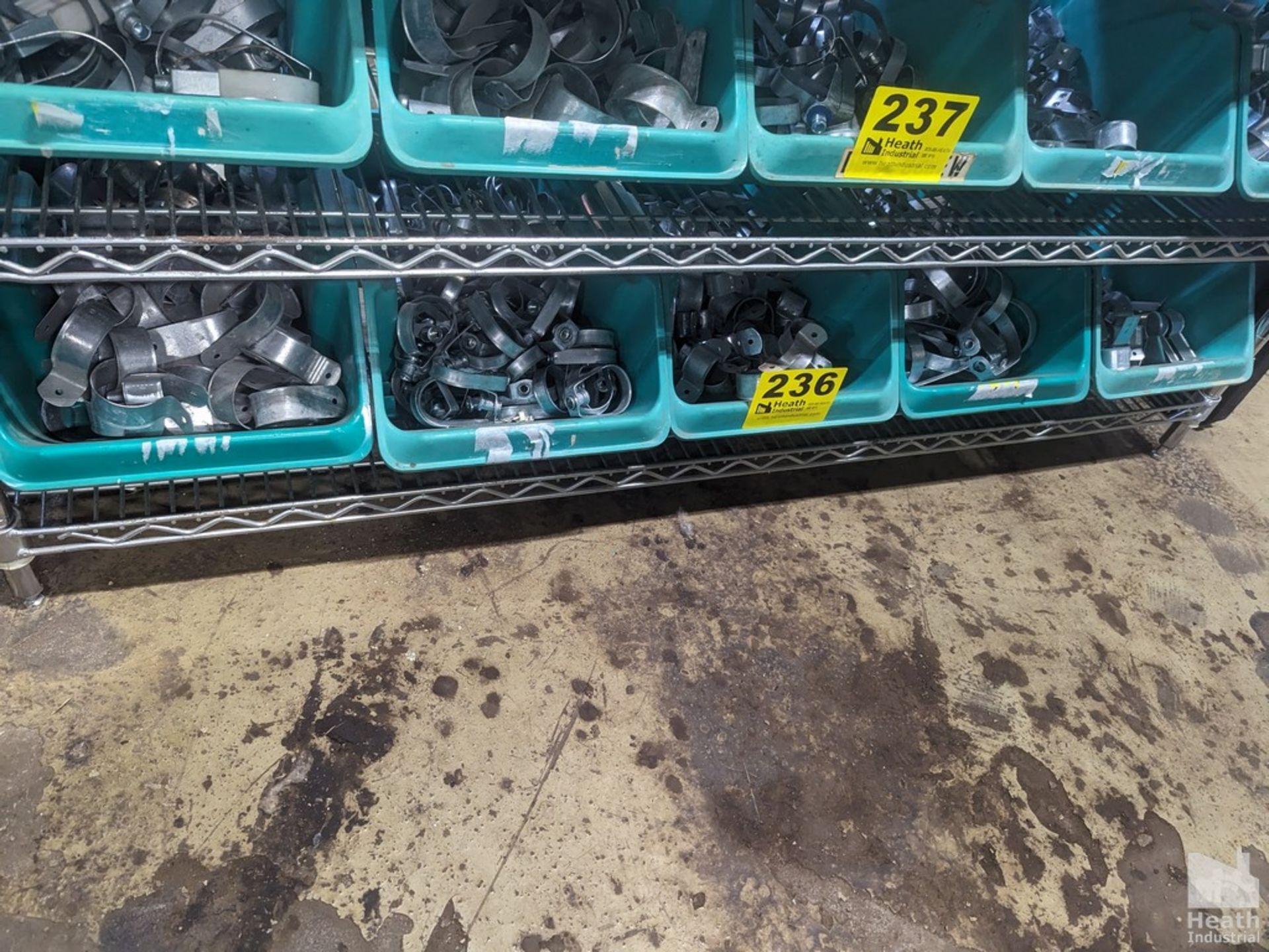 LARGE QUANTITY OF PIPE HANGERS ON SHELF (NO GREEN BINS, CONTENTS ONLY)