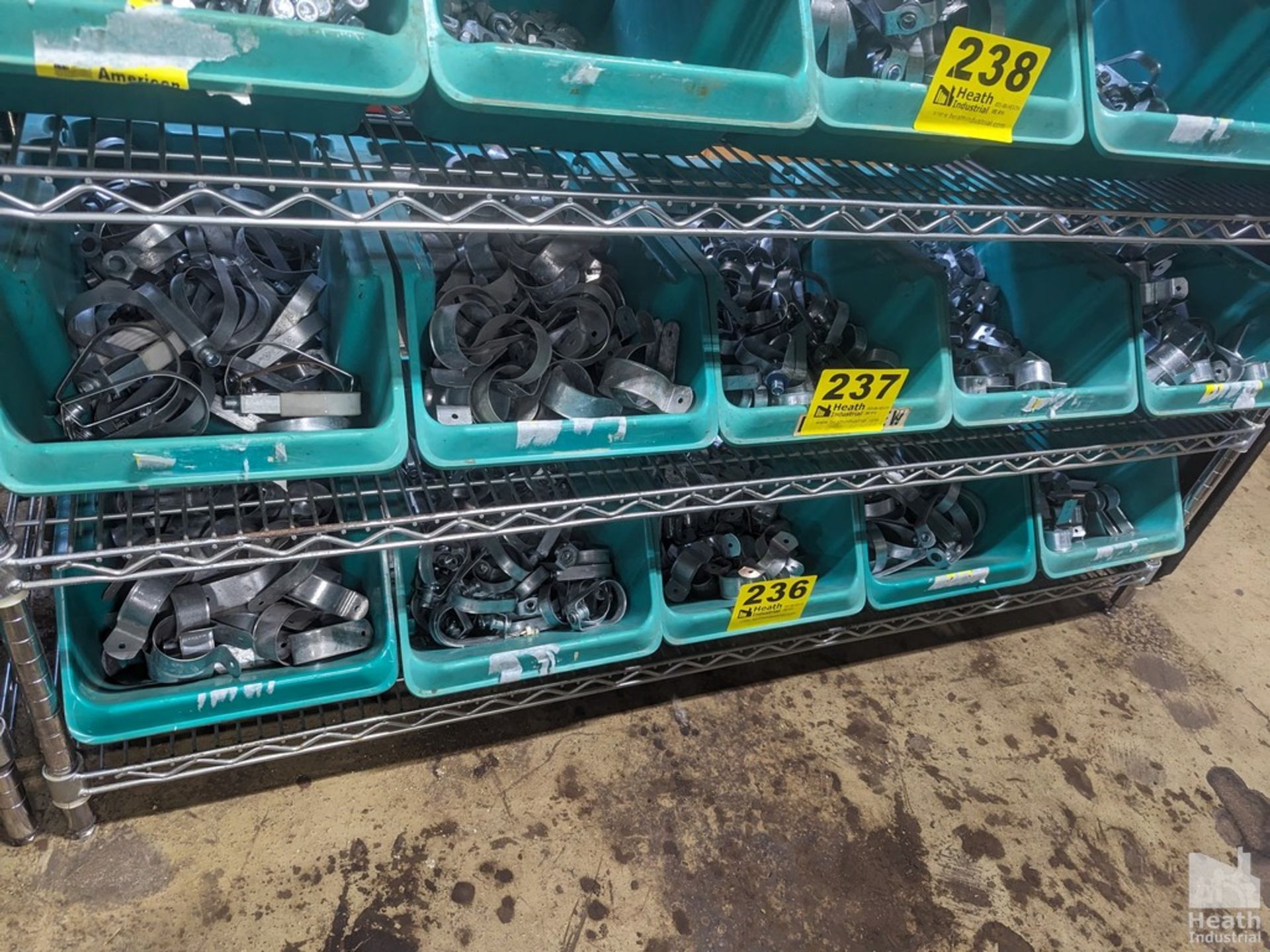 LARGE QUANTITY OF PIPE HANGERS ON SHELF (NO GREEN BINS, CONTENTS ONLY)