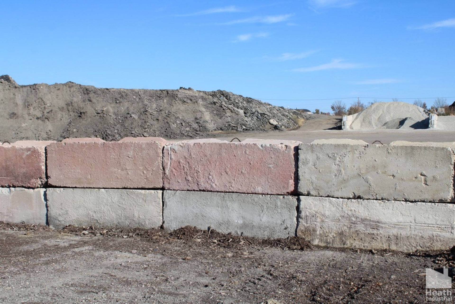 (25) CONCRETE BARRIERS 6' X 2' X 2' STACKABLE BIN BLOCKS (BUYER MUST BRING EQUIPMENT TO LOAD)