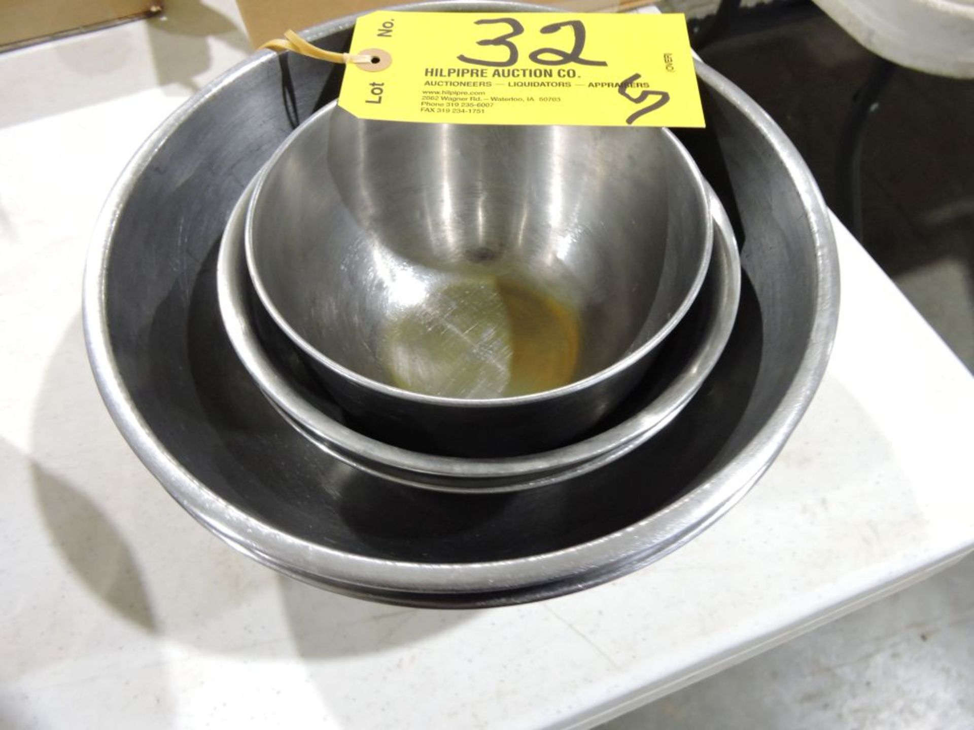 Smaller stainless steel mixing bowls.