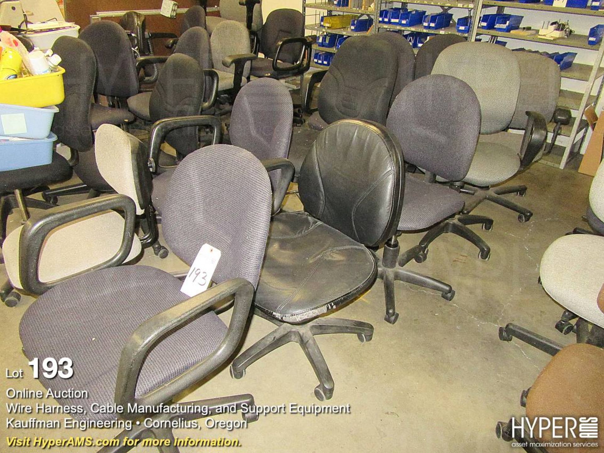 Assorted office chairs on casters.