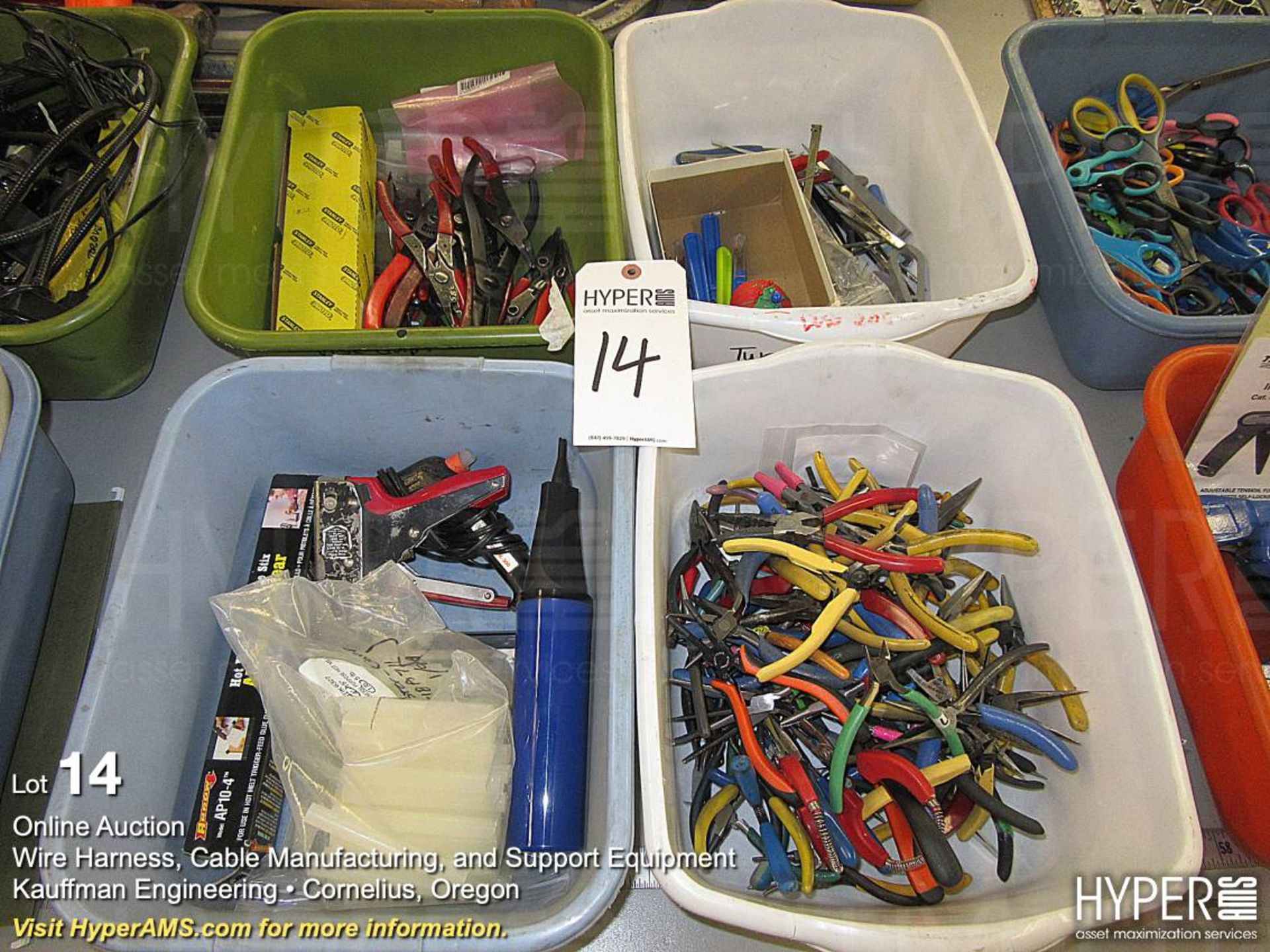 Plastic bins with assorted wire cutters, pliers and more