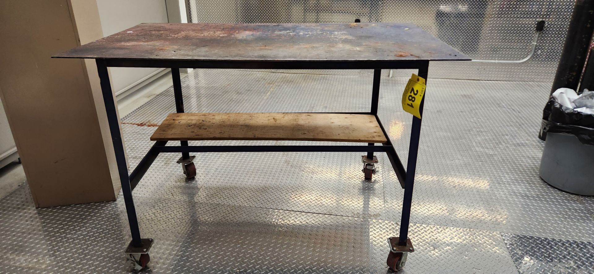 1/4" STEEL PLATE TABLE ON CASTORS, APPROX. 38"D X 64"W X 42"H