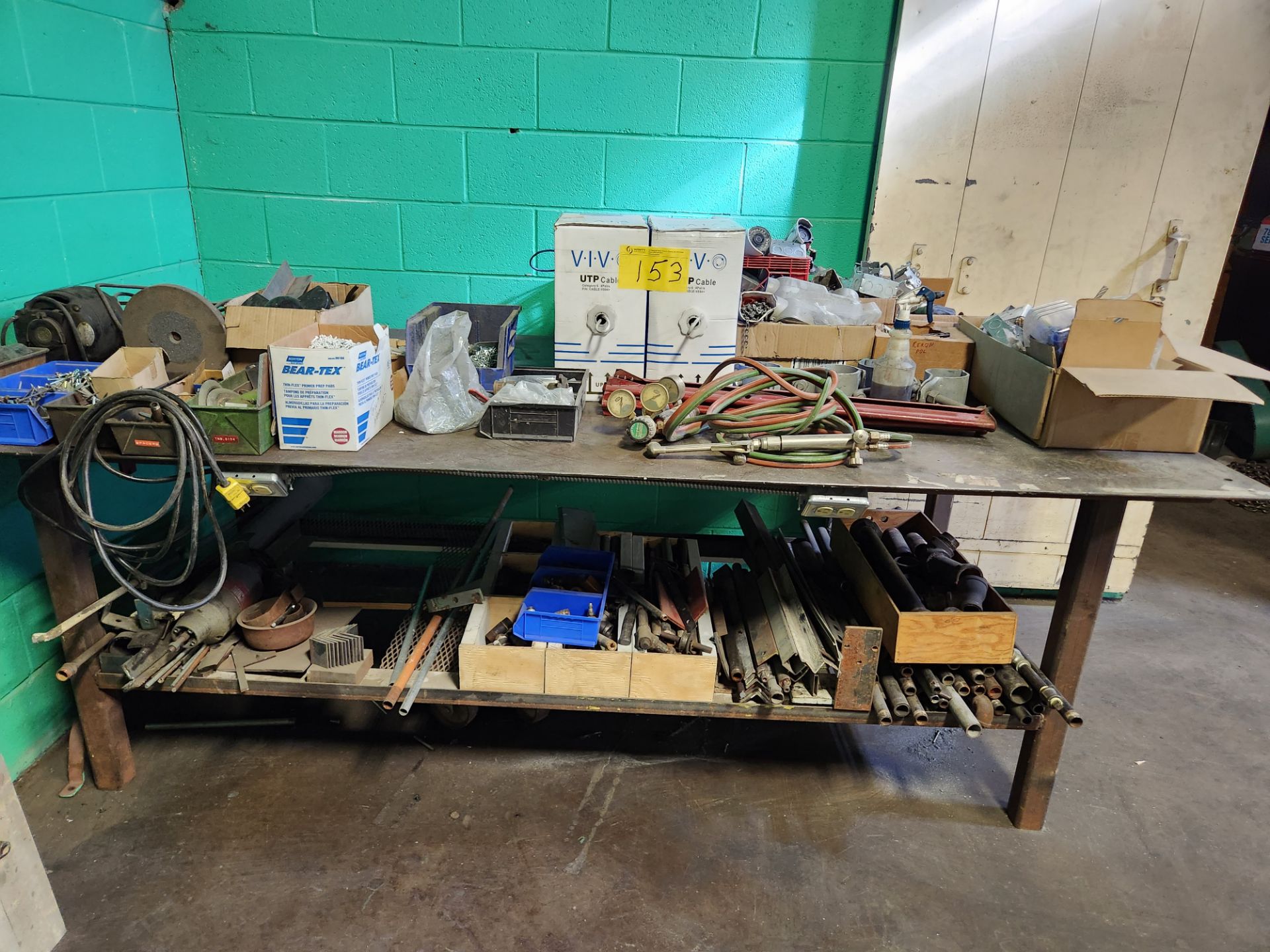 METAL WORKBENCH W/ CONTENTS INCLUDING ASST. OXY / ACETYLENE HOSE, GAUGES, ETC.