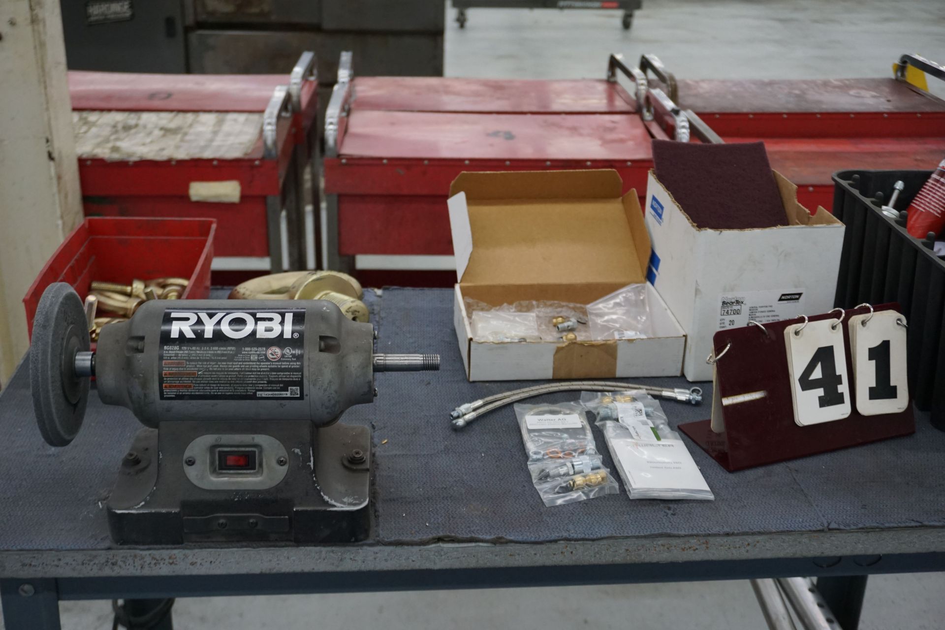 WORK TABLE W/ CONT: RYOBI 6" BENCH GRINDER, LIFTING EYES, LEVELERS, MISC REPAIR PARTS AS SHOWN