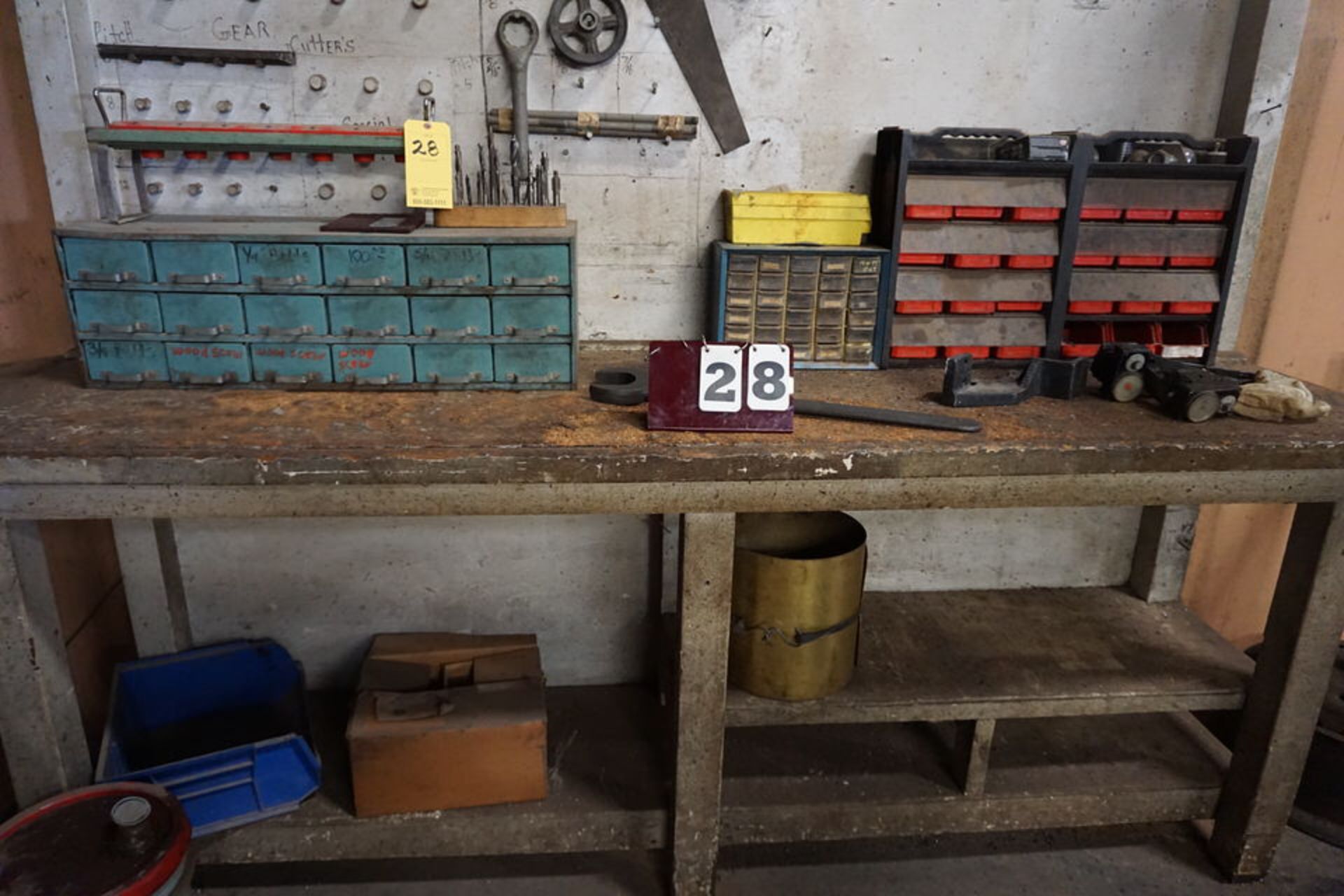 WOOD WORK BENCH W/ CONT: SMALL PARTS BINS MISC TOOLS ON WALL