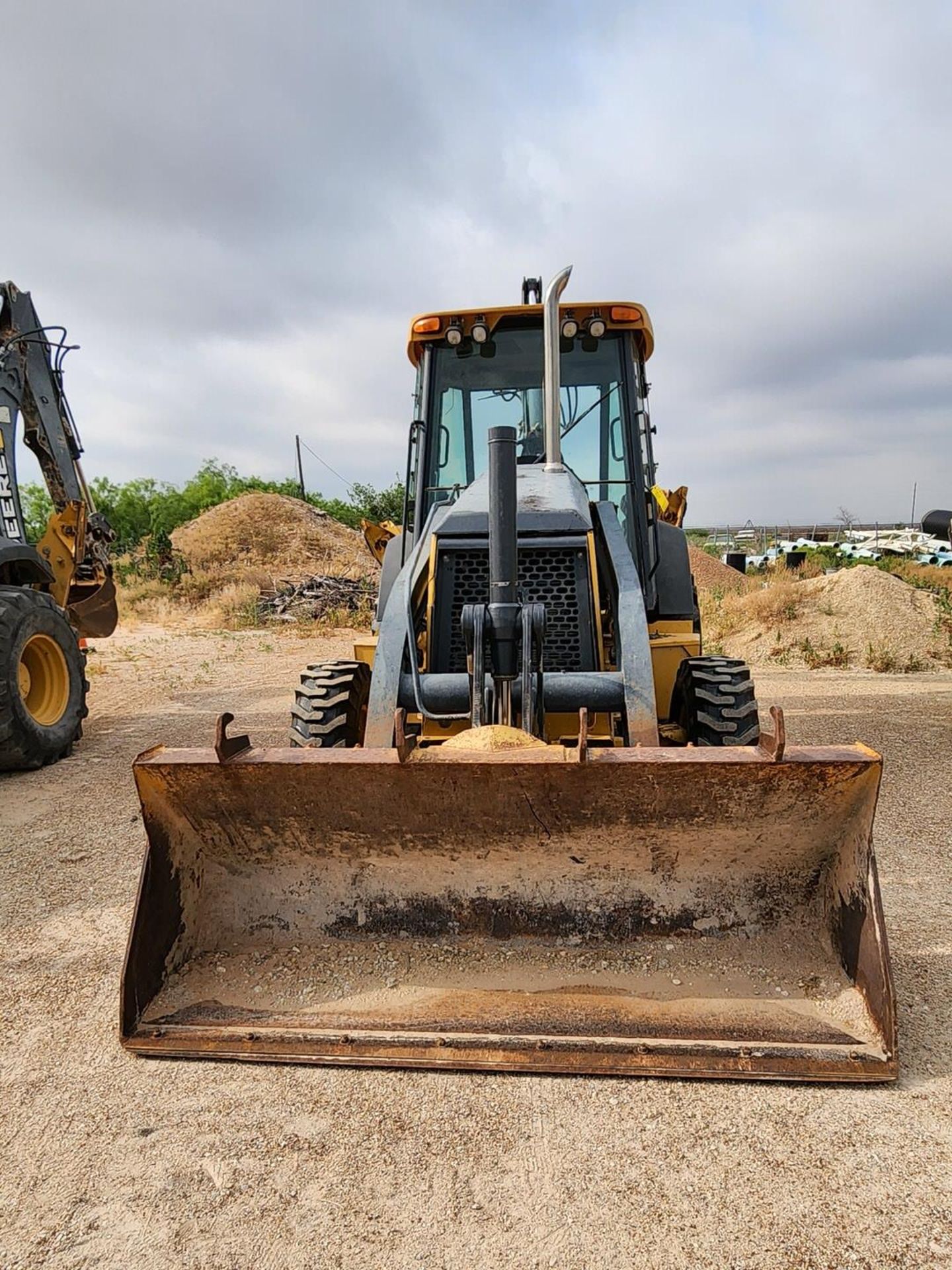 2007 John Deere 410J Backhoe Loader W/ 1.5 cu/yd Bucket & W/ Self Aligning Roller Bearing; Pin: