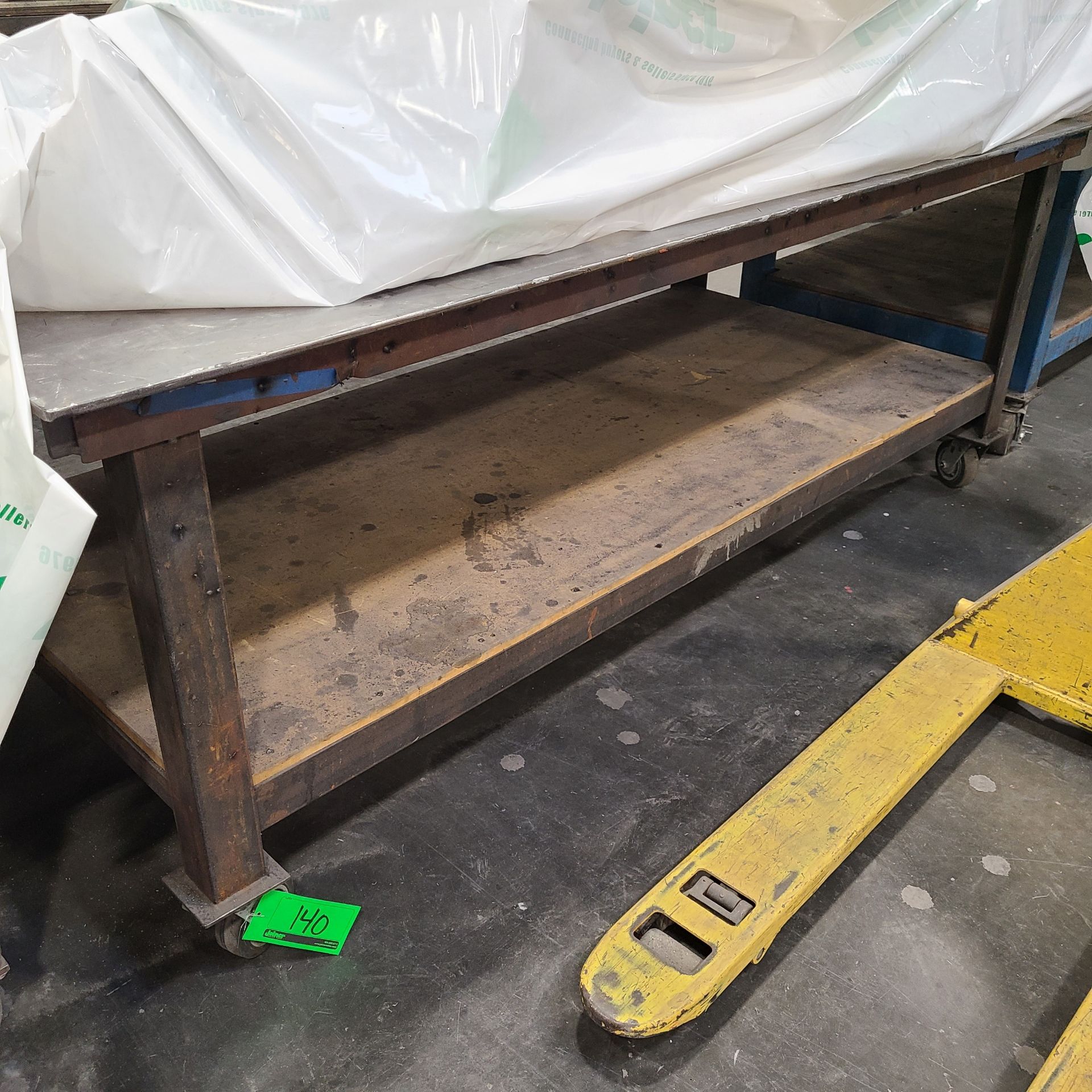 4 FT. x 8 FT. STEEL WORK TABLE ON CASTERS