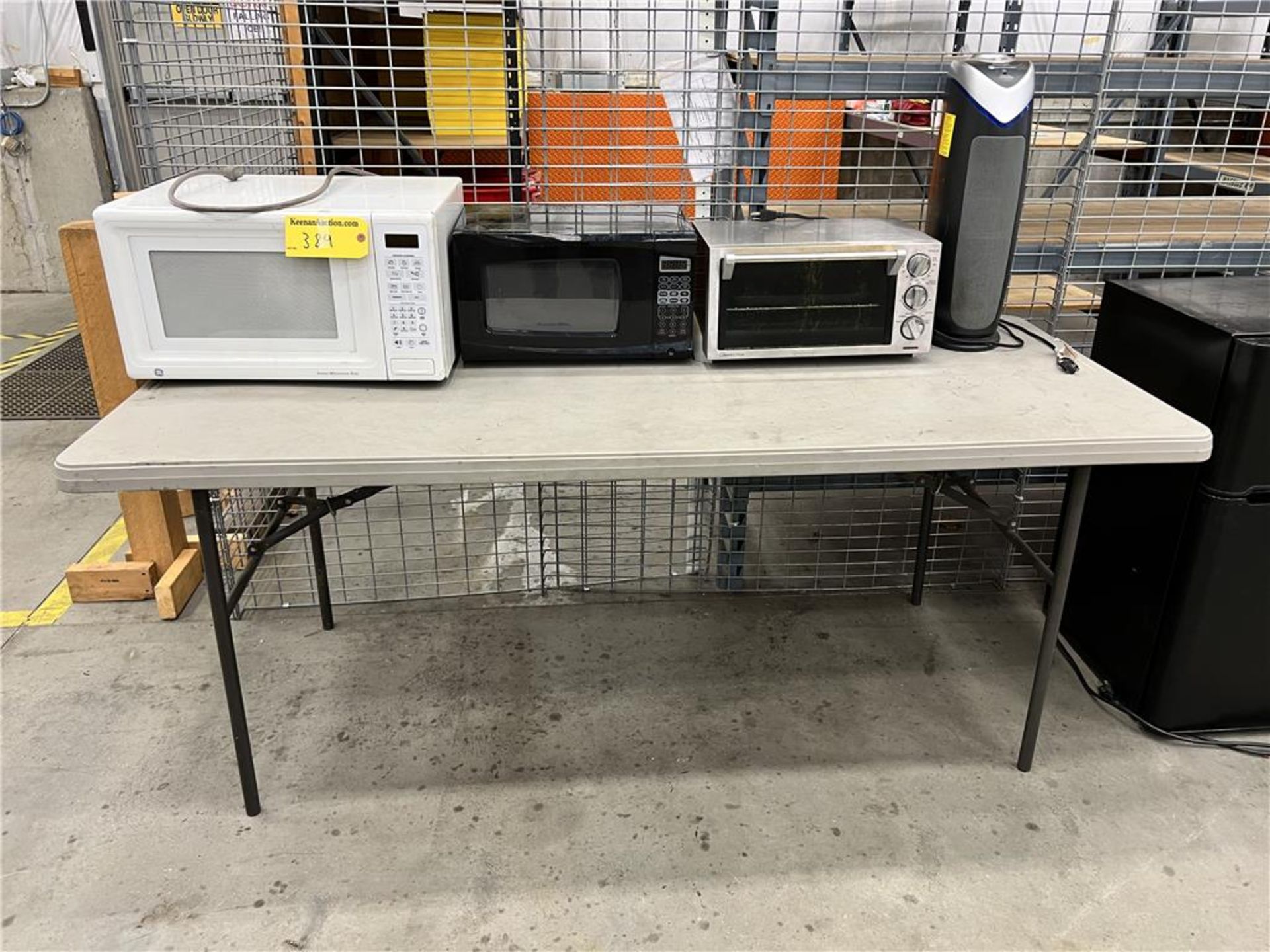 LOT: 2-MICROWAVES, TOASTER OVEN, FAN, 6' FOLDING TABLE