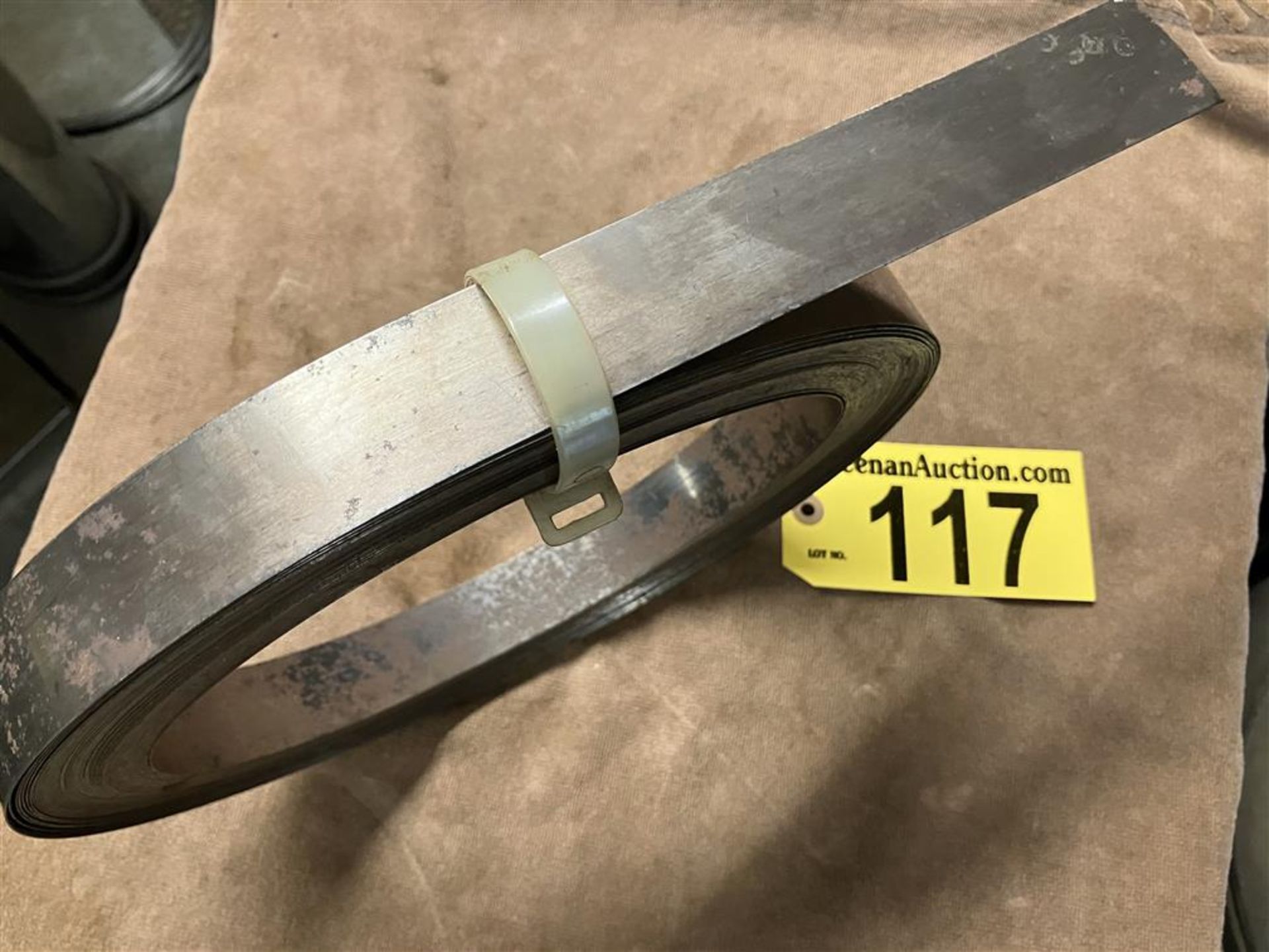 ROLL OF TEMPERED STEEL 1.25”X 0.017” (27 GA) ABOUT 11.5 LBS