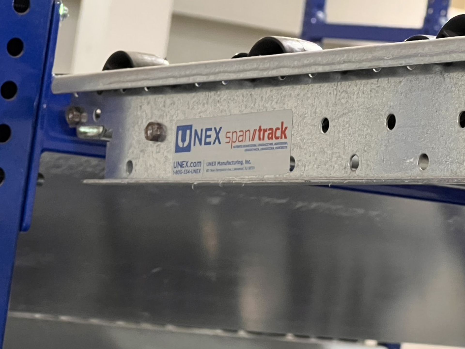(2) UNEX SPAN TRACK PRODUCT PACK-OFF RACKS, WITH ROLLER CONVEYOR, INCLUDES SINGLE DOOR CONTROL PANEL - Image 18 of 18