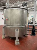 Used approximately 1400 gallon stainless steel vertical mixing tank. Approximately 76" diameter X
