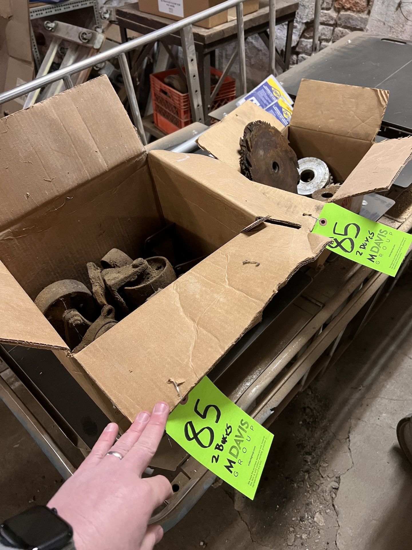 BOX OF CASTERS AND SAW BLADES