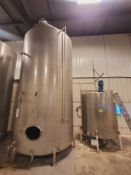 Vance Metal 6100 gallon capacity vertical type 304 stainless steel single wall storage tank.