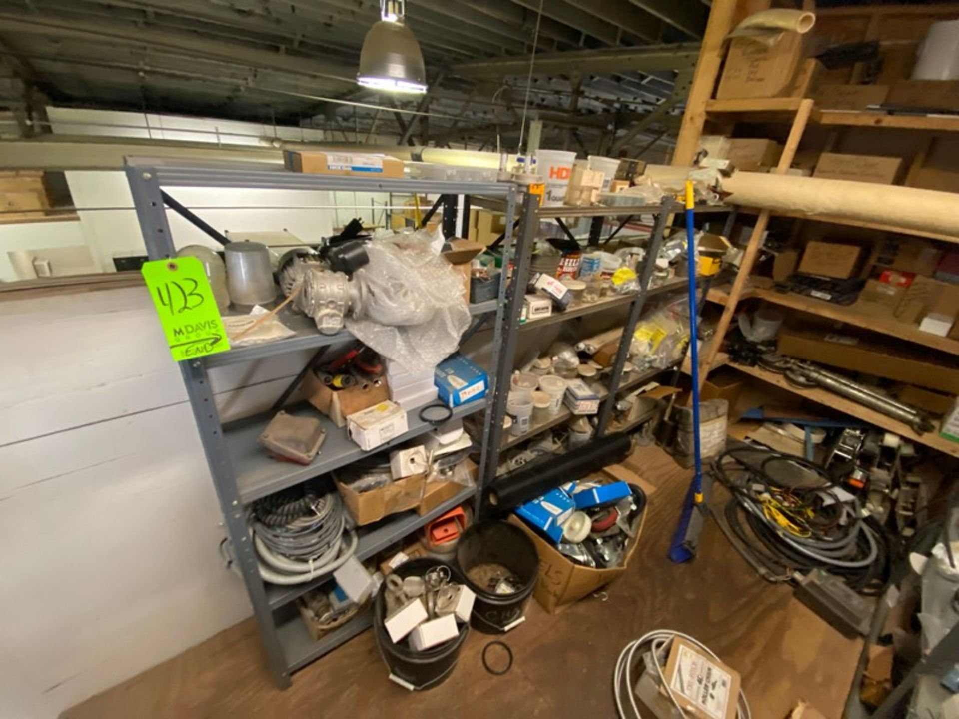 CONTENTS OF MIDDLE SHELVING UNITS, INCLUDES BELTS, ASSORTED ELECTRICAL PLUGS, LIGHT PROTECTION UNITS