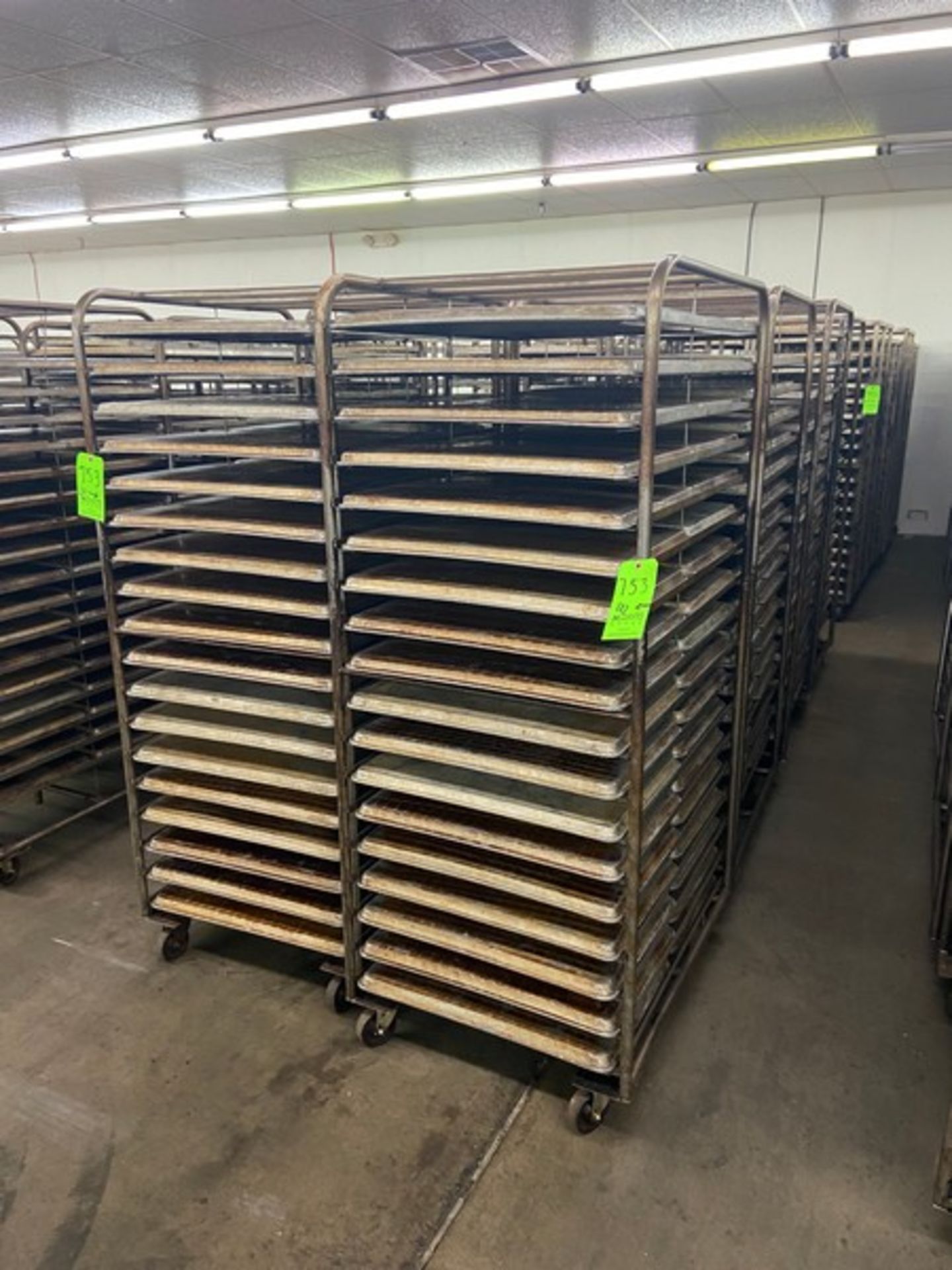 (8) PORTABLE DOUBLE SIDED BAKING PAN RACKS, MOUNTED ON CASTERS (LOCATED IN HERMITAGE, PA)