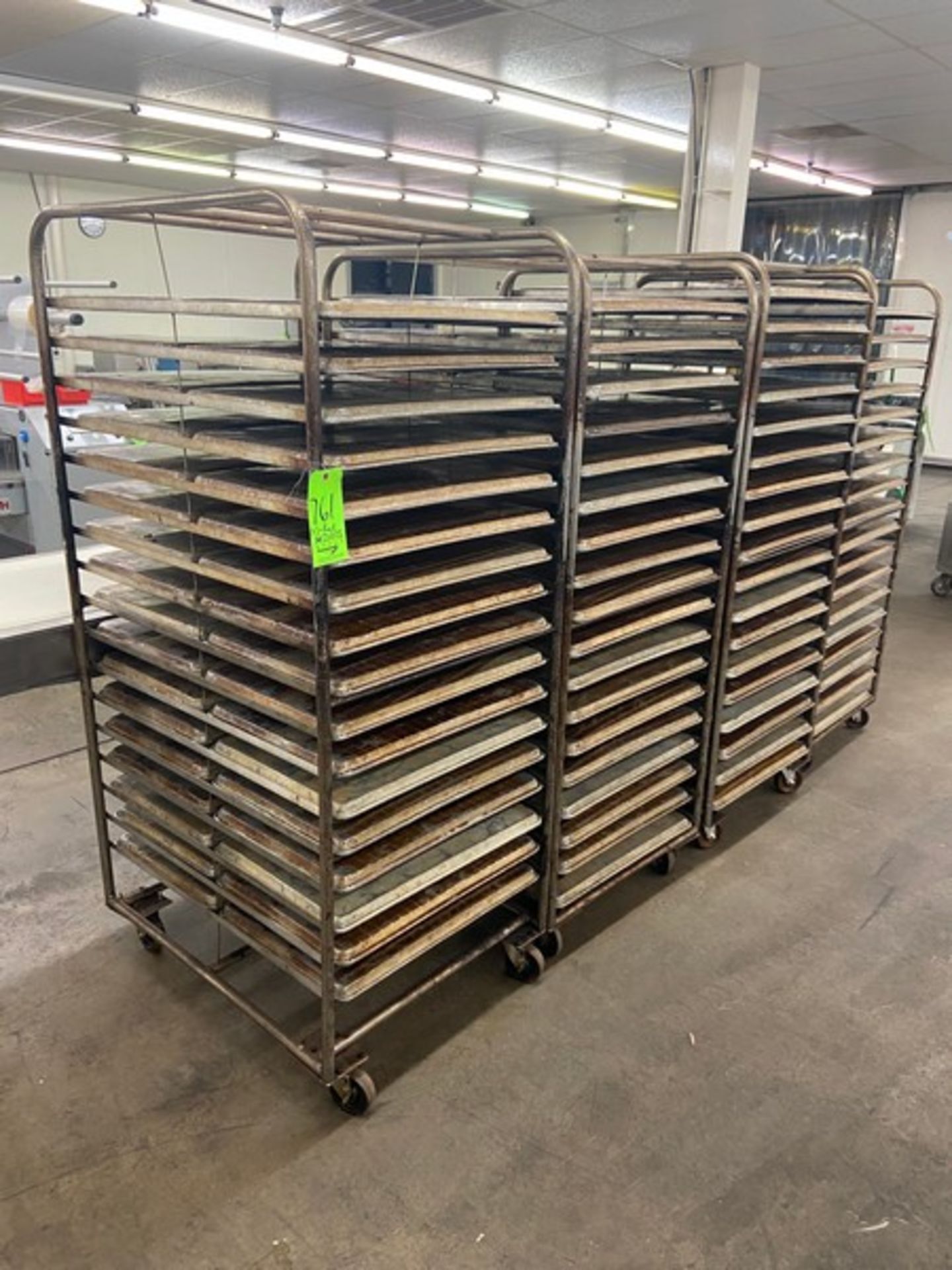 (4) PORTABLE DOUBLE SIDED BAKING PAN RACKS, MOUNTED ON CASTERS (LOCATED IN HERMITAGE, PA)