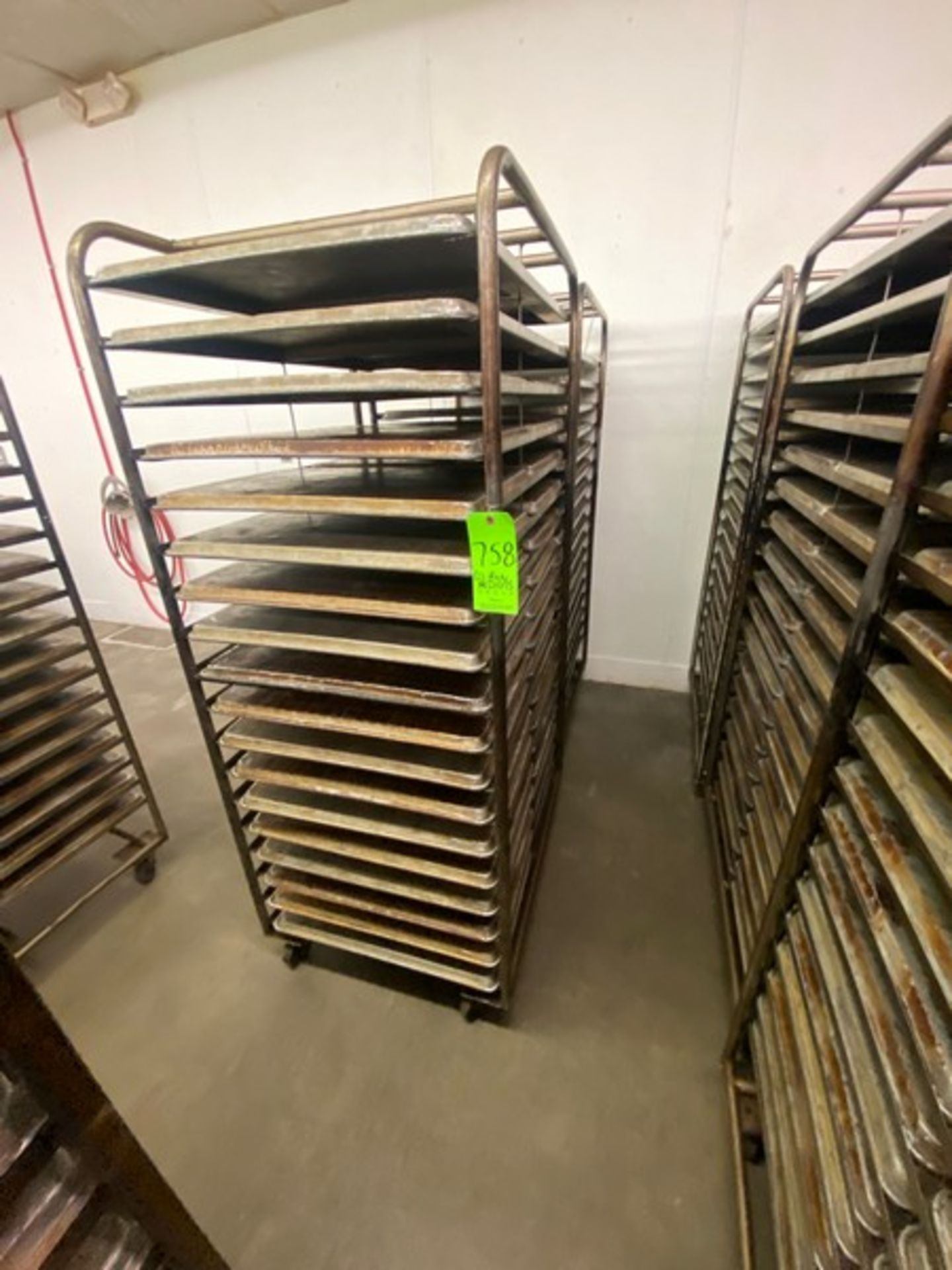 (2) PORTABLE DOUBLE SIDED BAKING PAN RACKS, MOUNTED ON CASTERS (LOCATED IN HERMITAGE, PA)