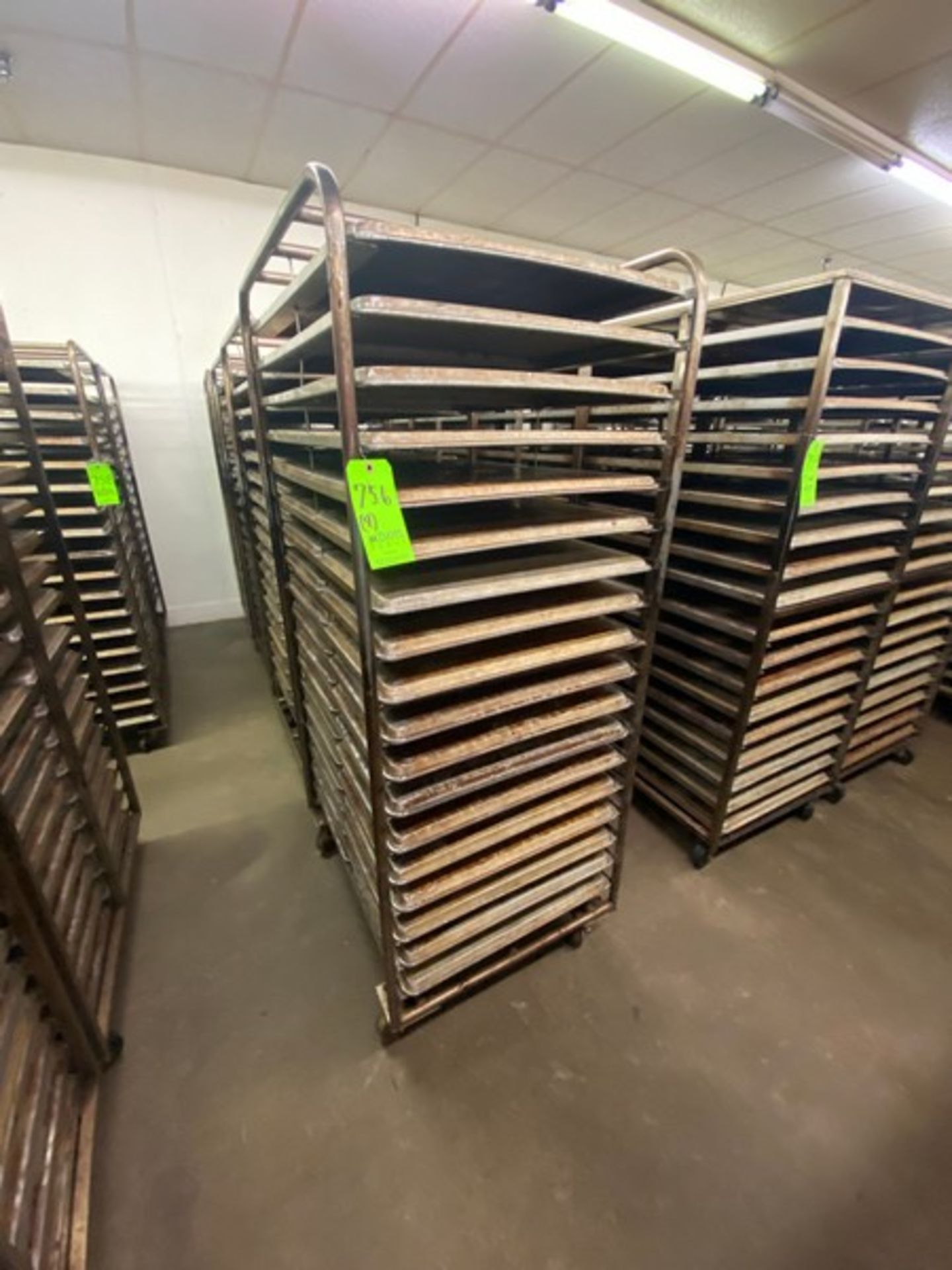 (4) PORTABLE DOUBLE SIDED BAKING PAN RACKS, MOUNTED ON CASTERS (LOCATED IN HERMITAGE, PA)