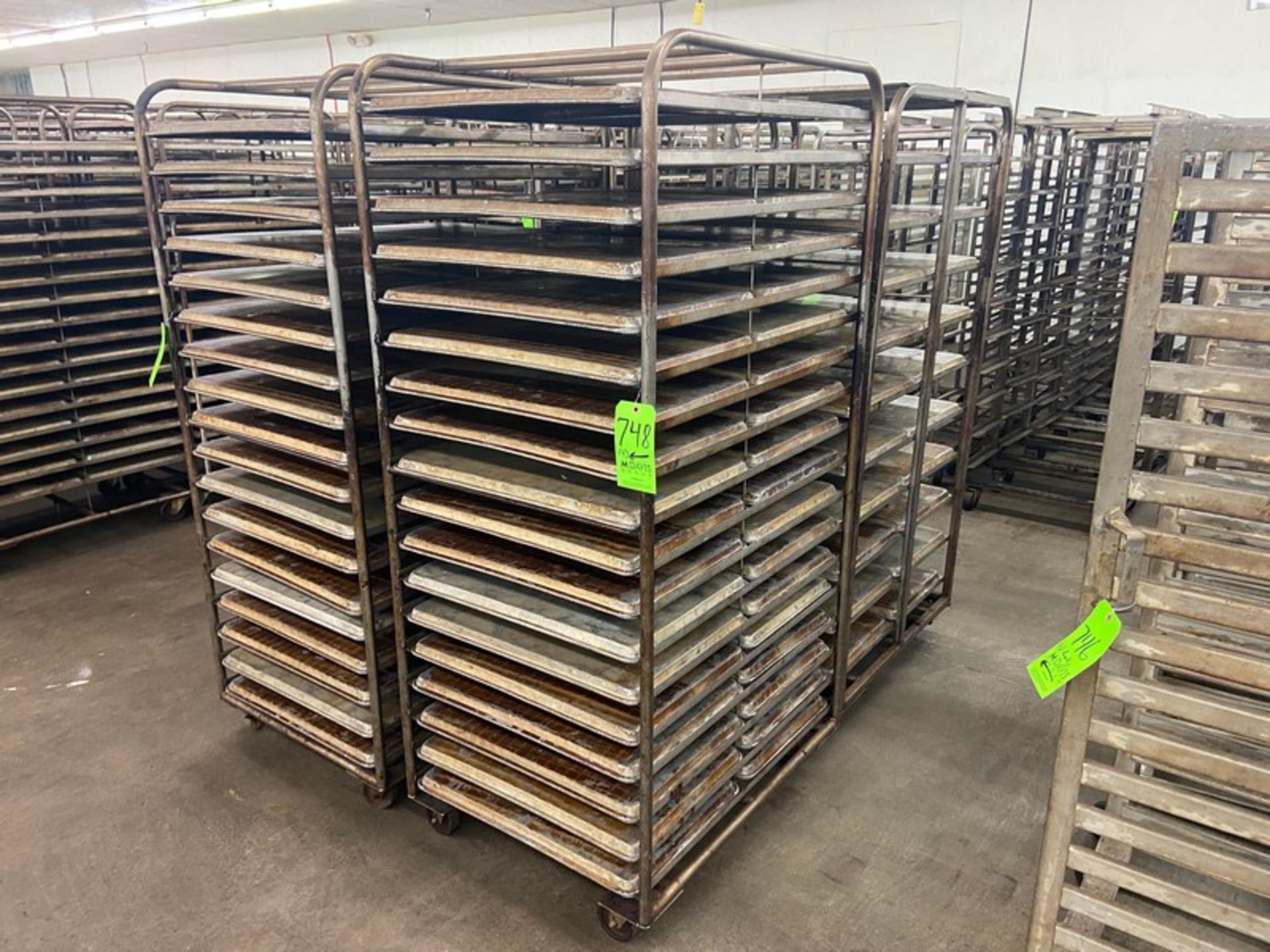 (4) PORTABLE DOUBLE SIDED BAKING PAN RACKS, MOUNTED ON CASTERS (LOCATED IN HERMITAGE, PA)