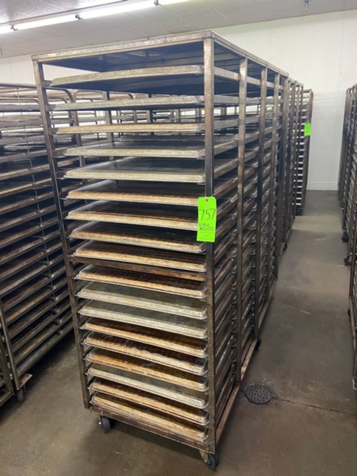 (4) PORTABLE DOUBLE SIDED BAKING PAN RACKS, MOUNTED ON CASTERS (LOCATED IN HERMITAGE, PA)