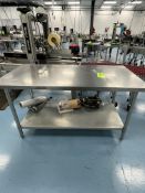 STAINLESS STEEL TABLE TOP AND UNDERSHELF DIMENSIONS APPROXIMATELY 60" L 30" W 32" H.
