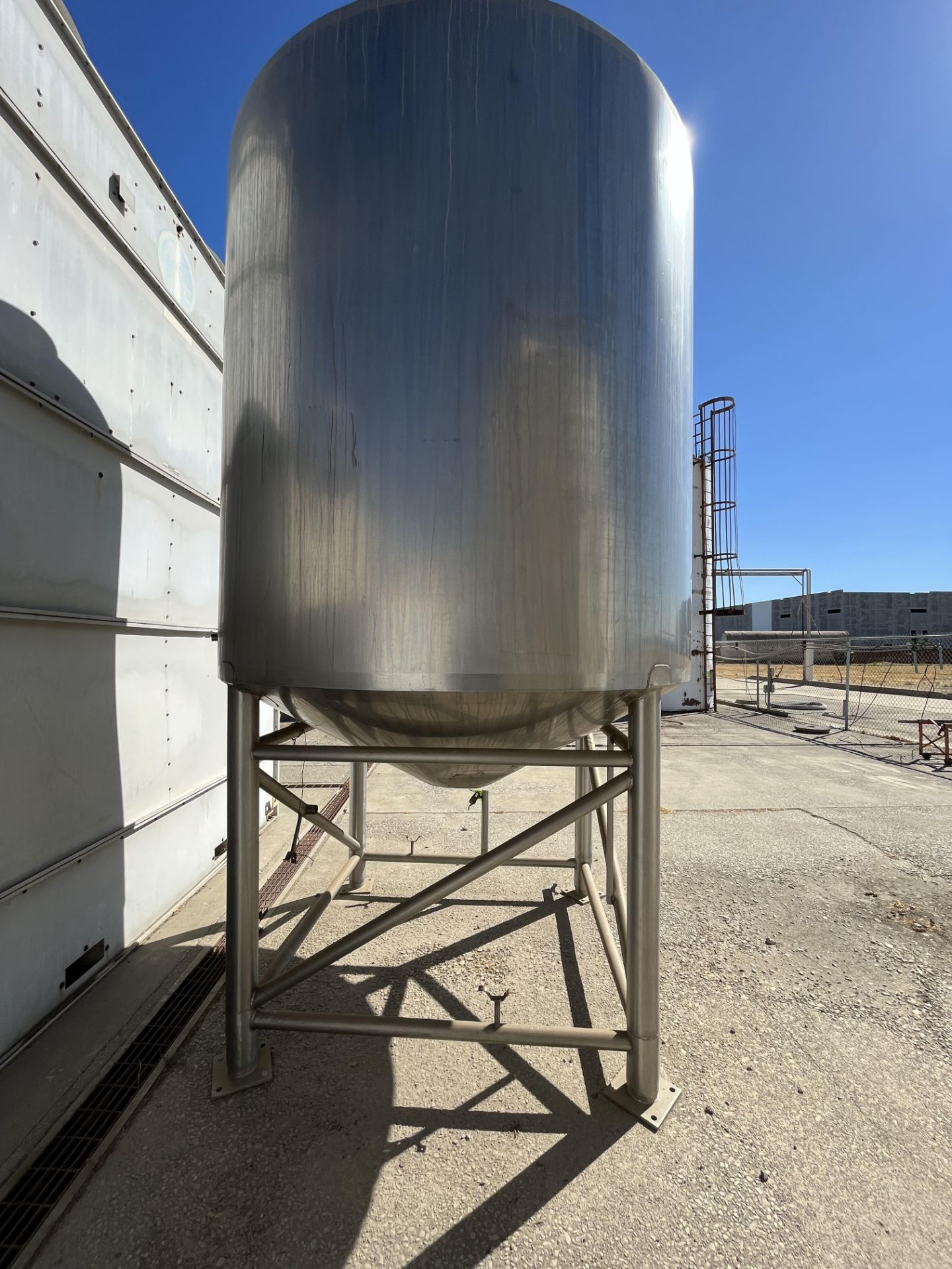 Sani-Fab Jacketed S/S Tank, Tank Dims.: Aprox. 7 ft. Tall x 80” Dia., Cone Bottom, Mounted on S/S