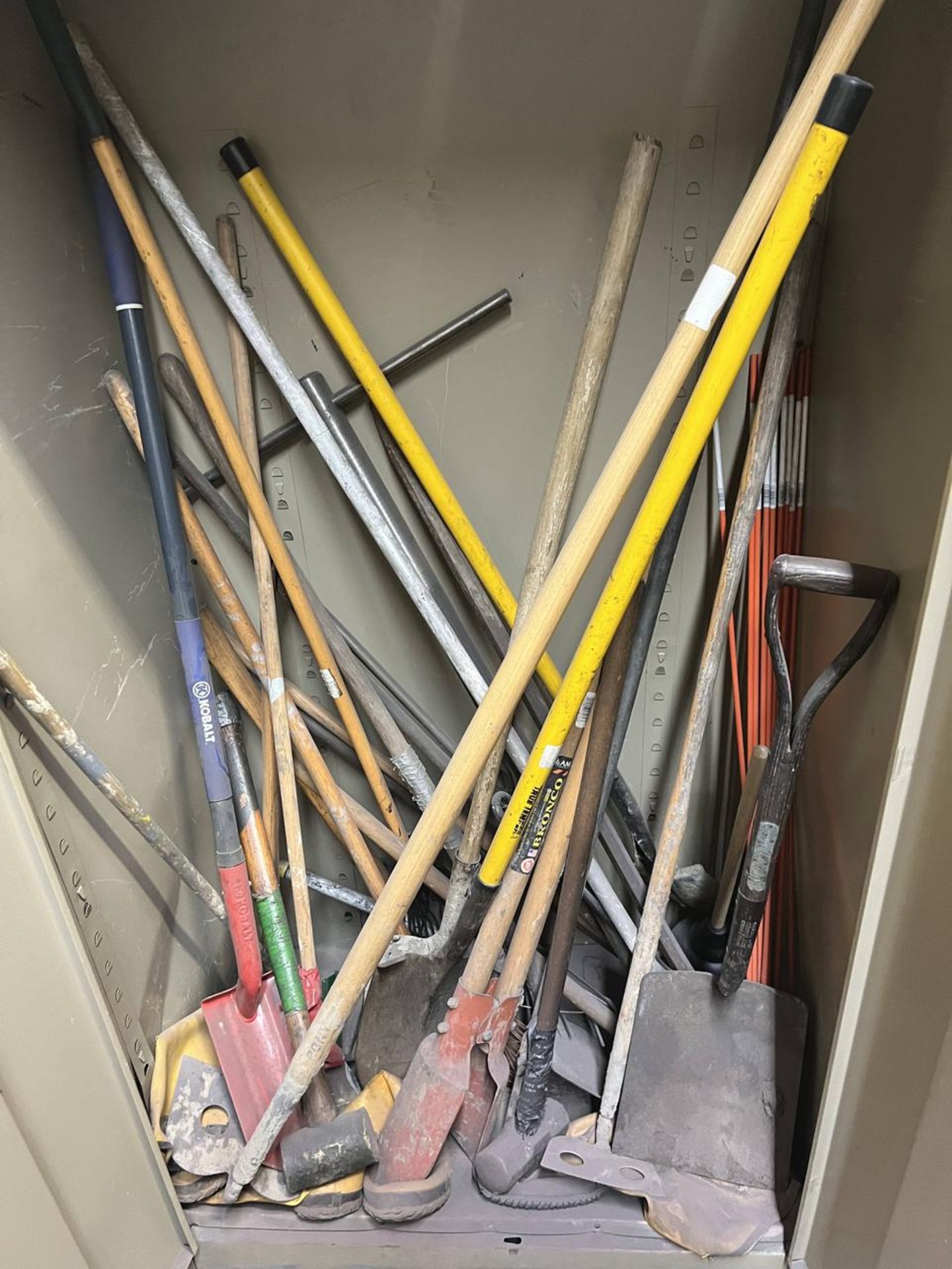 CABINET WITH CONTENTS OF SHOVELS