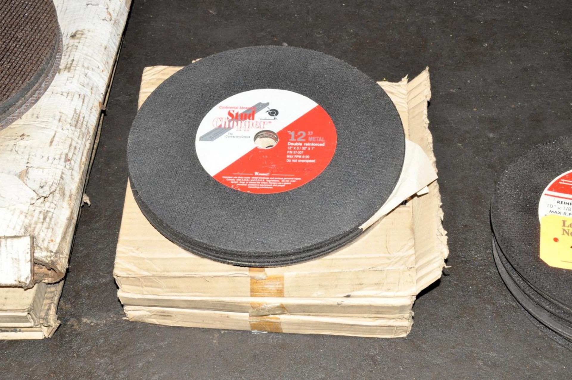 Lot of Abrasive Cutoff Wheels in (3) Stacks Under (1) Table - Image 3 of 4