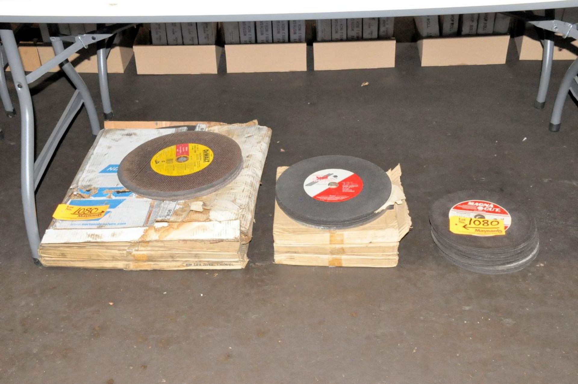 Lot of Abrasive Cutoff Wheels in (3) Stacks Under (1) Table