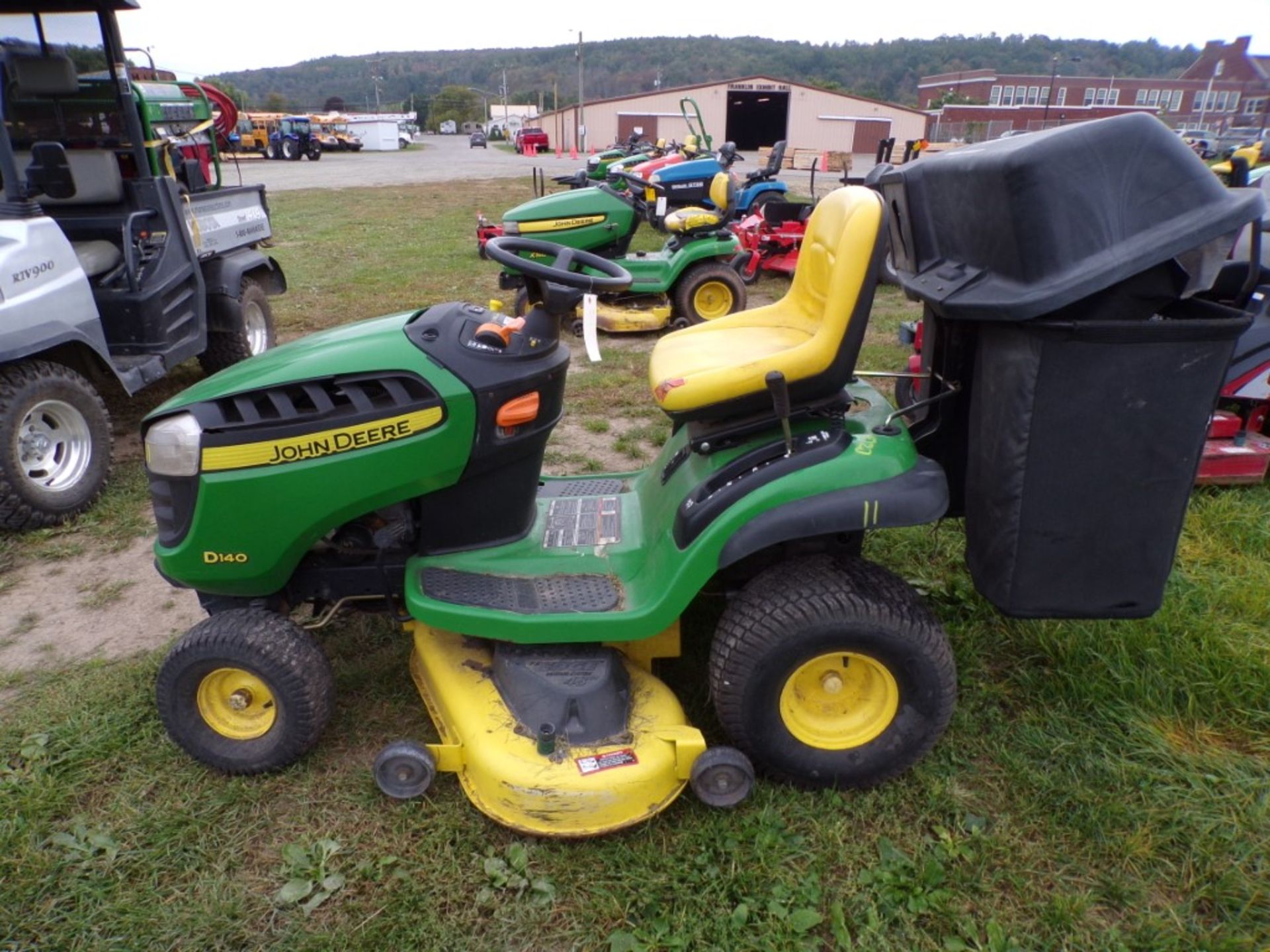 John Deere D140 Riding Mower w/48'' Deck, 22 HP Engine, Seat Is Ripped, Has Bagger, Looks