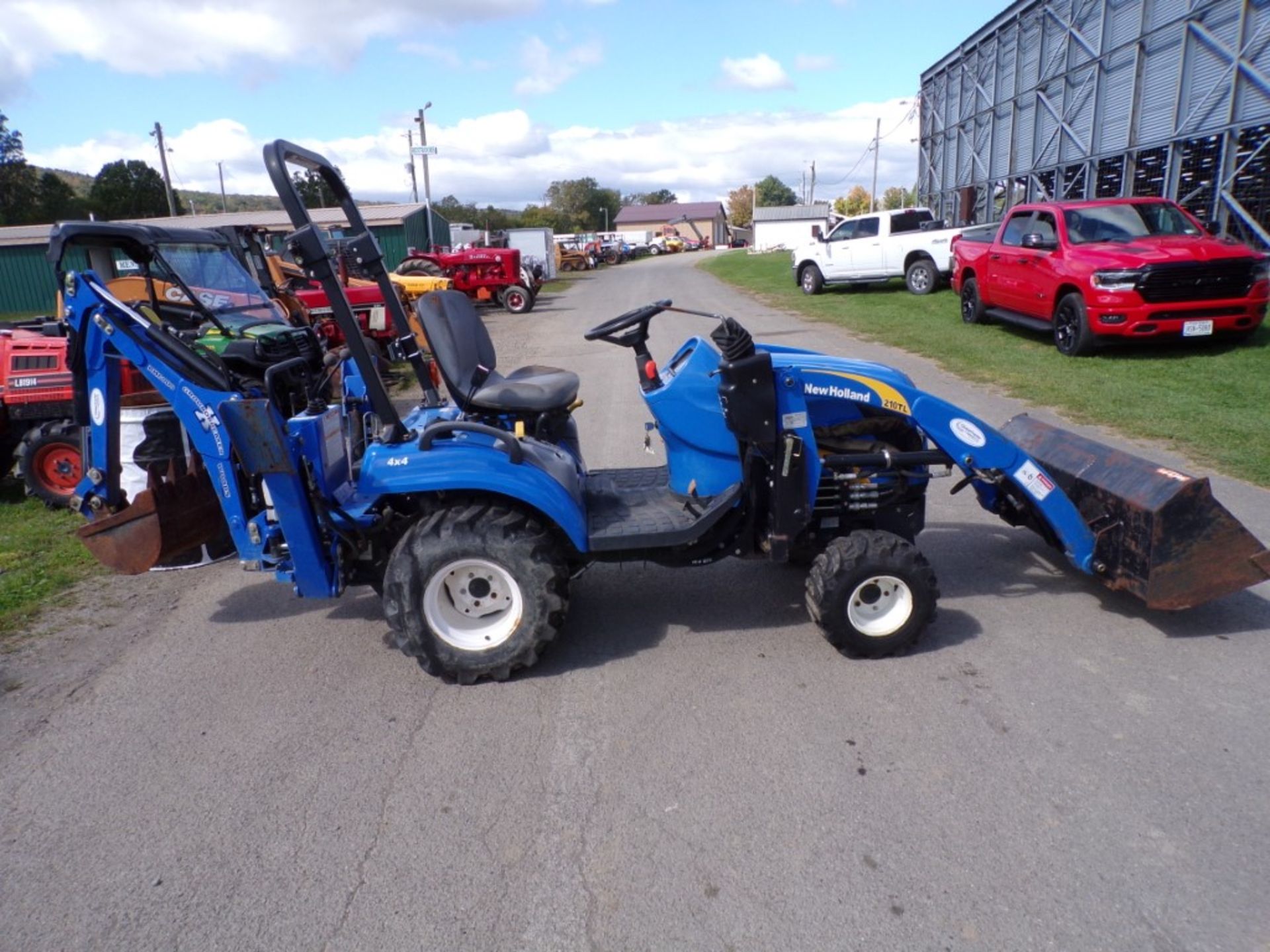 New Holland Boomer 1025 Tractor, 4 WD, Shibaura Dsl. Engine, N.H. 210TL Loader ARms And 48'' Bucket,