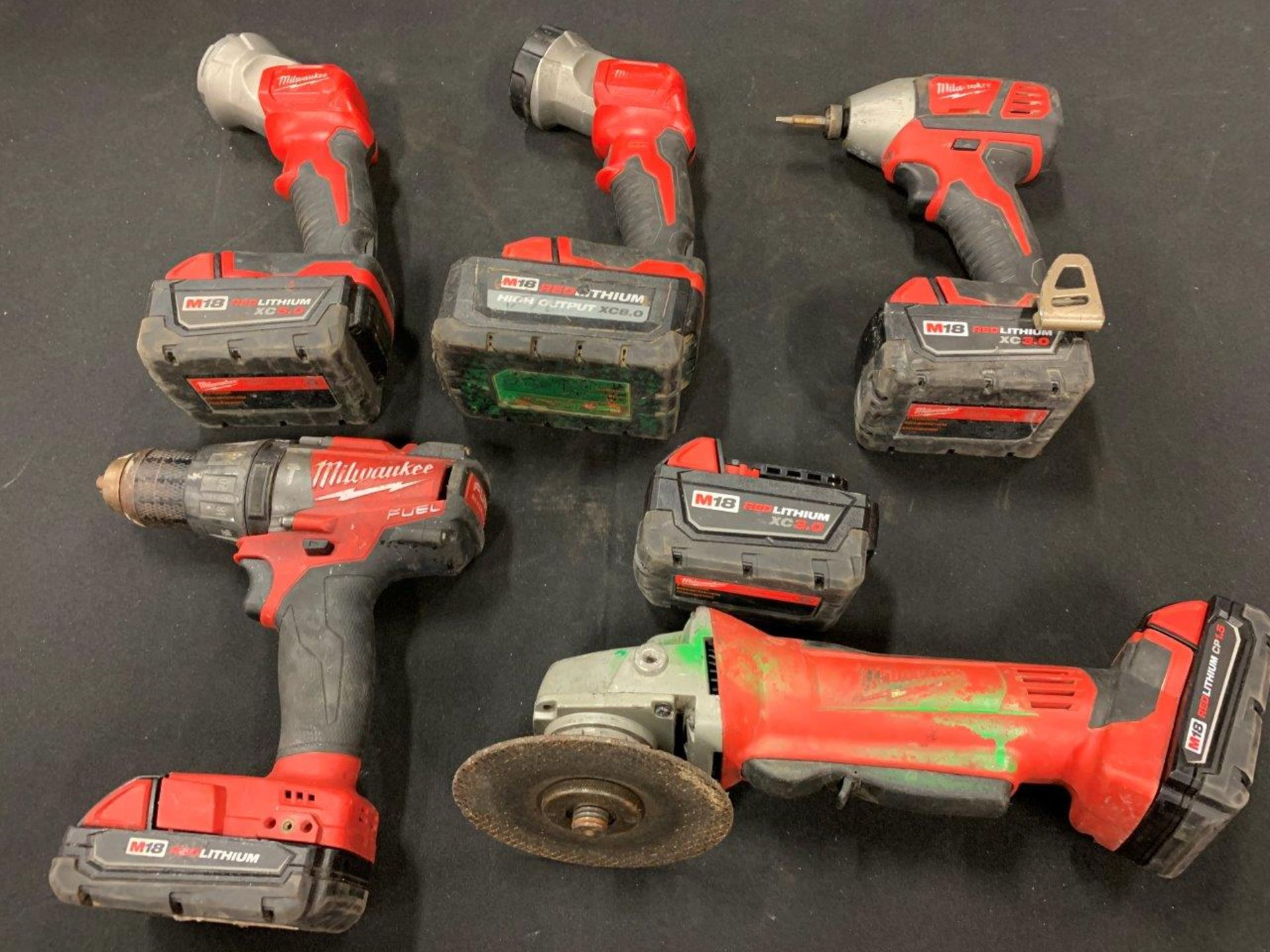 MILWAUKEE CORDLESS ANGLE GRINDER, DRILL, IMPACT DRIVER, FLASHLIGHT, ASSORTED BATTERIES - A58