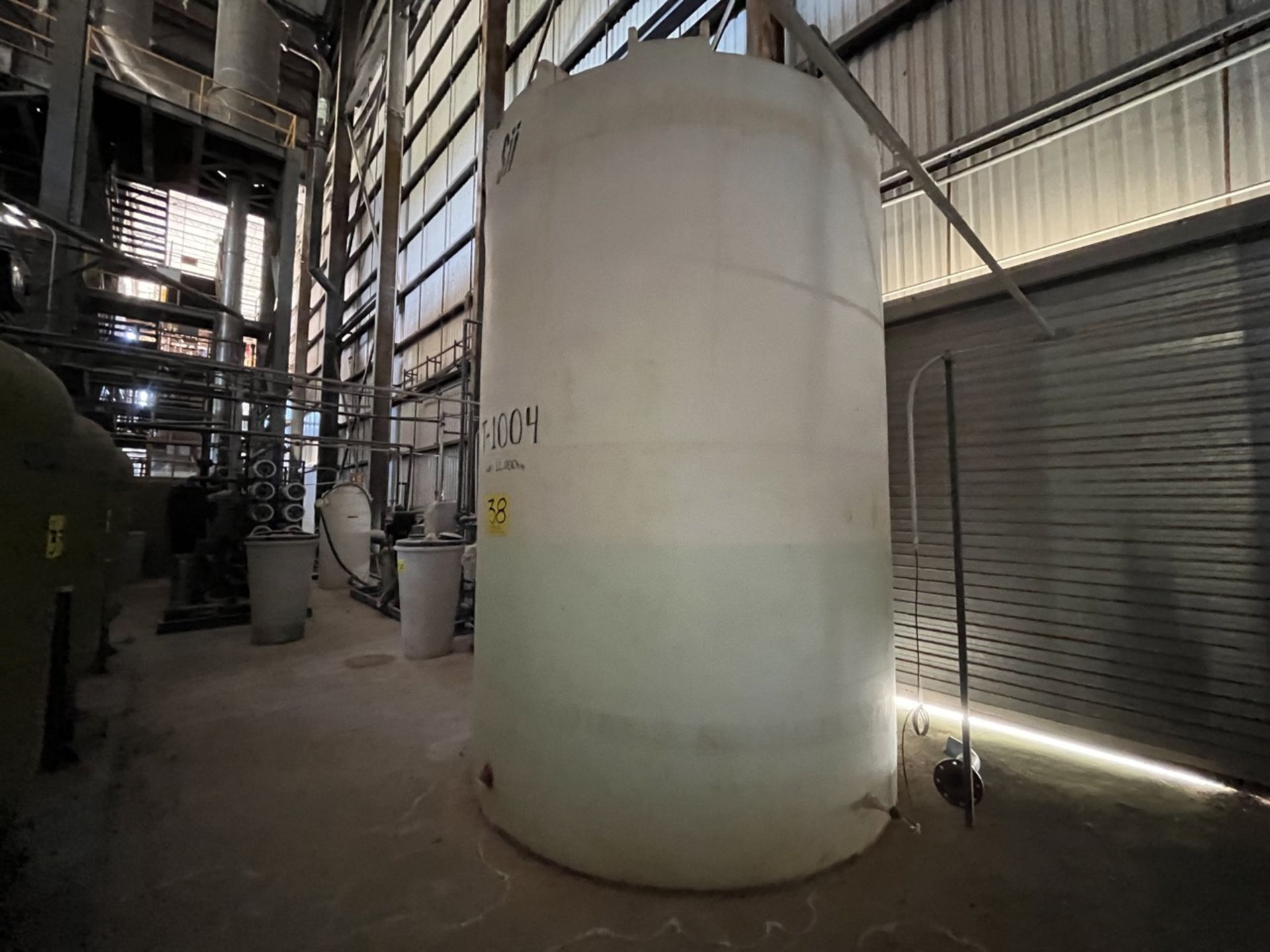 Plastic water storage tank with a capacity of 12,000 liters measuring approx 2.40 meters diameter x