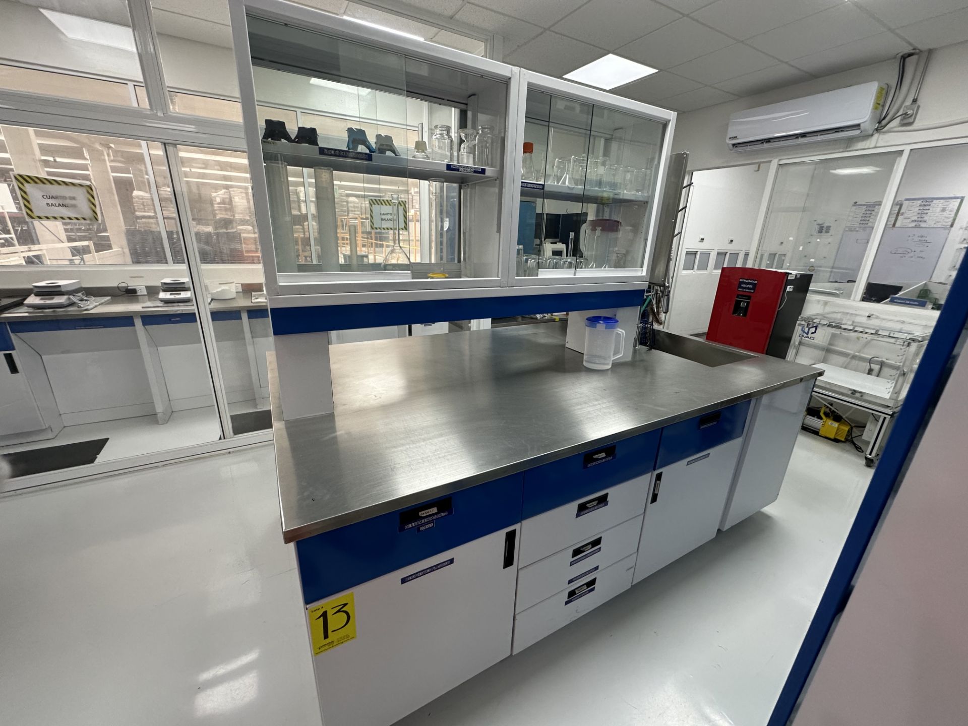 1 Central laboratory cabinet with stainless steel cover and sink, measures approximately 2.45 x 1.4