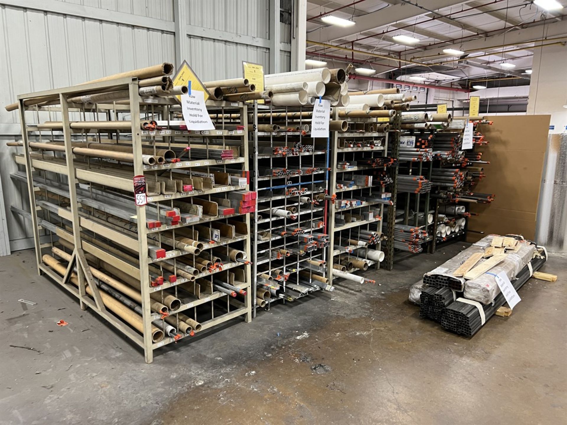 Lot of Stock Racks w/ Assorted Stock Including Aluminum and Steel Flat stock, Round Tubing, and