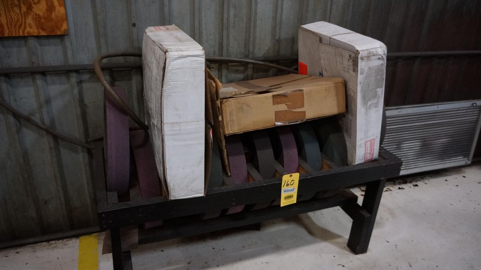 LOT CONSISTING OF: (1) pallet of grinding wheels, (1) stand, approx. 13", (stand included)
