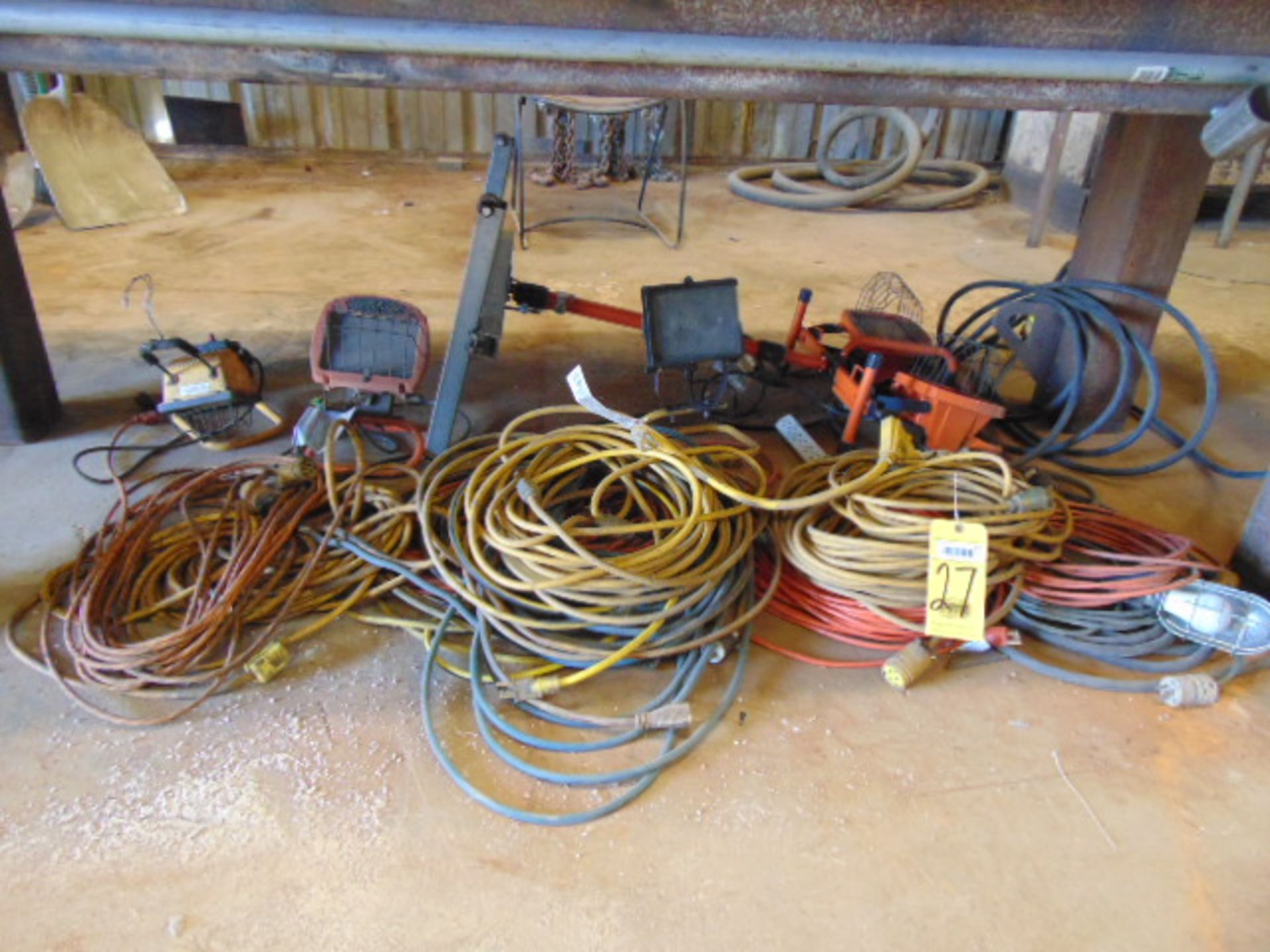 LOT OF ELECTRIC EXTENSION CORDS & LIGHTS (under one table)