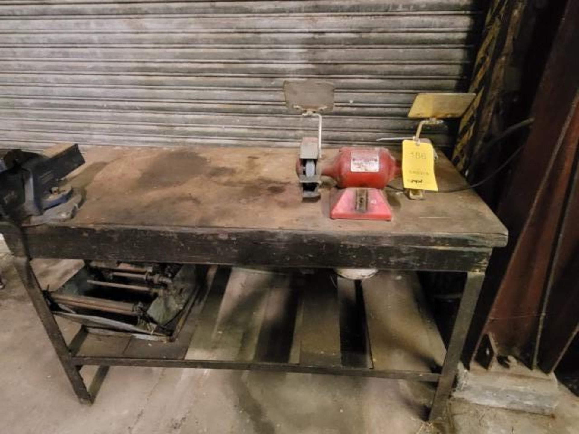 LOT: 5' Wood Workbench w/ (1) Baldor 3 HP Grinder and (1) Table Vise