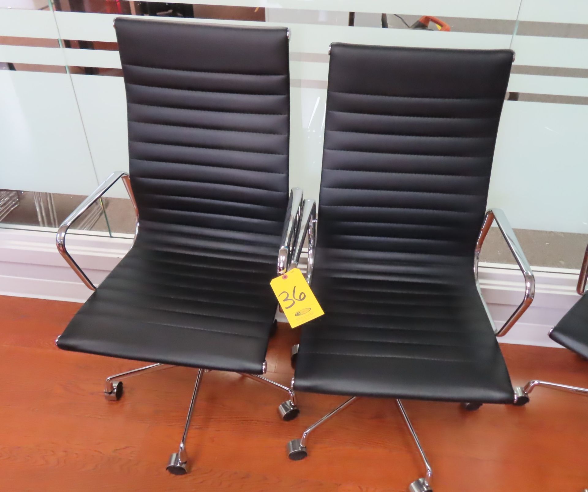 (2) BLACK LEATHER-TYPE HIGH ROLL-BACK PNEUMATIC BASE CONFERENCE CHAIRS