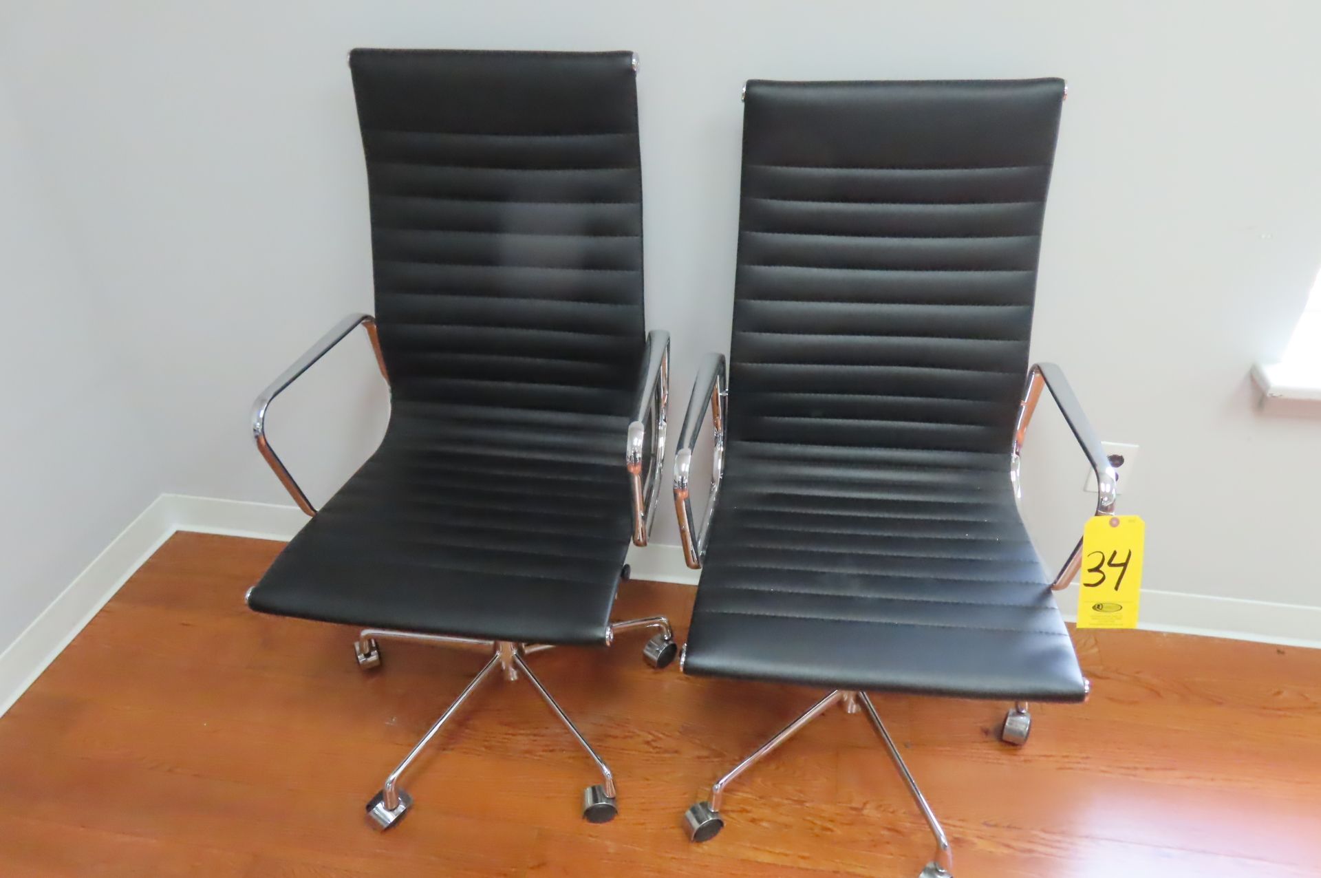 (2) BLACK LEATHER-TYPE HIGH ROLL-BACK PNEUMATIC BASE CONFERENCE CHAIRS