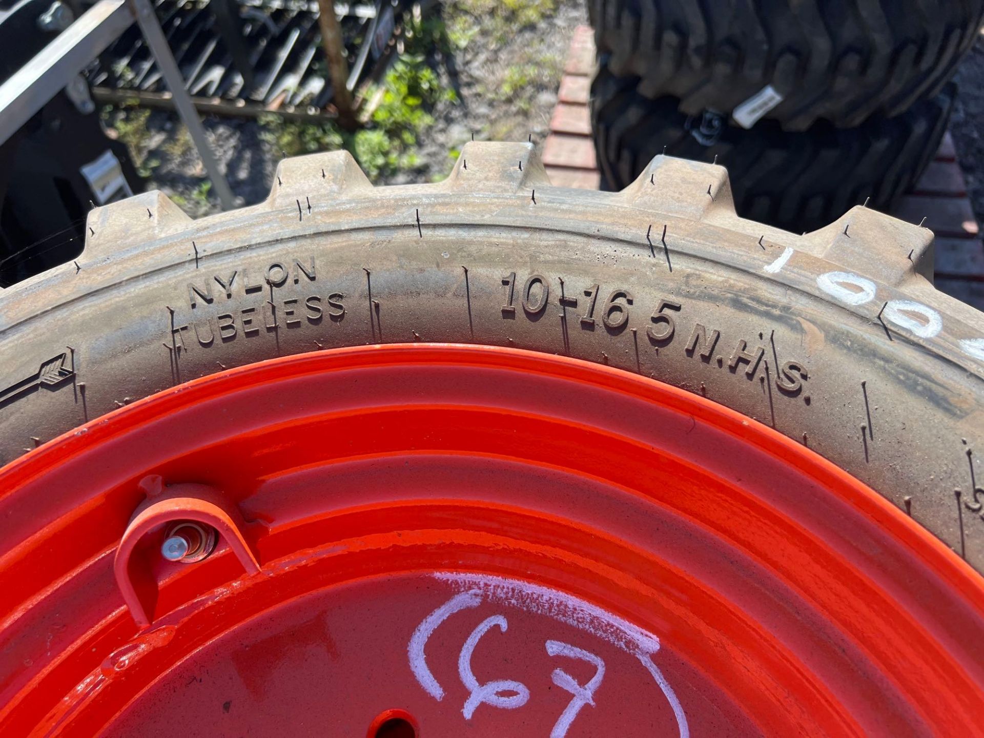 (4) 2022 Skid Steer Tires with Wheels - Image 6 of 7