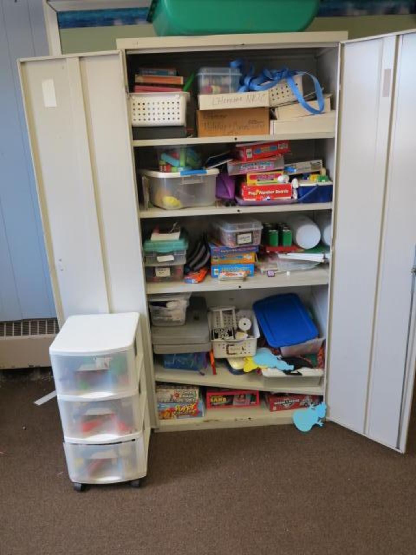 2 Door Cabinet with Contents of Games Located in Room 19