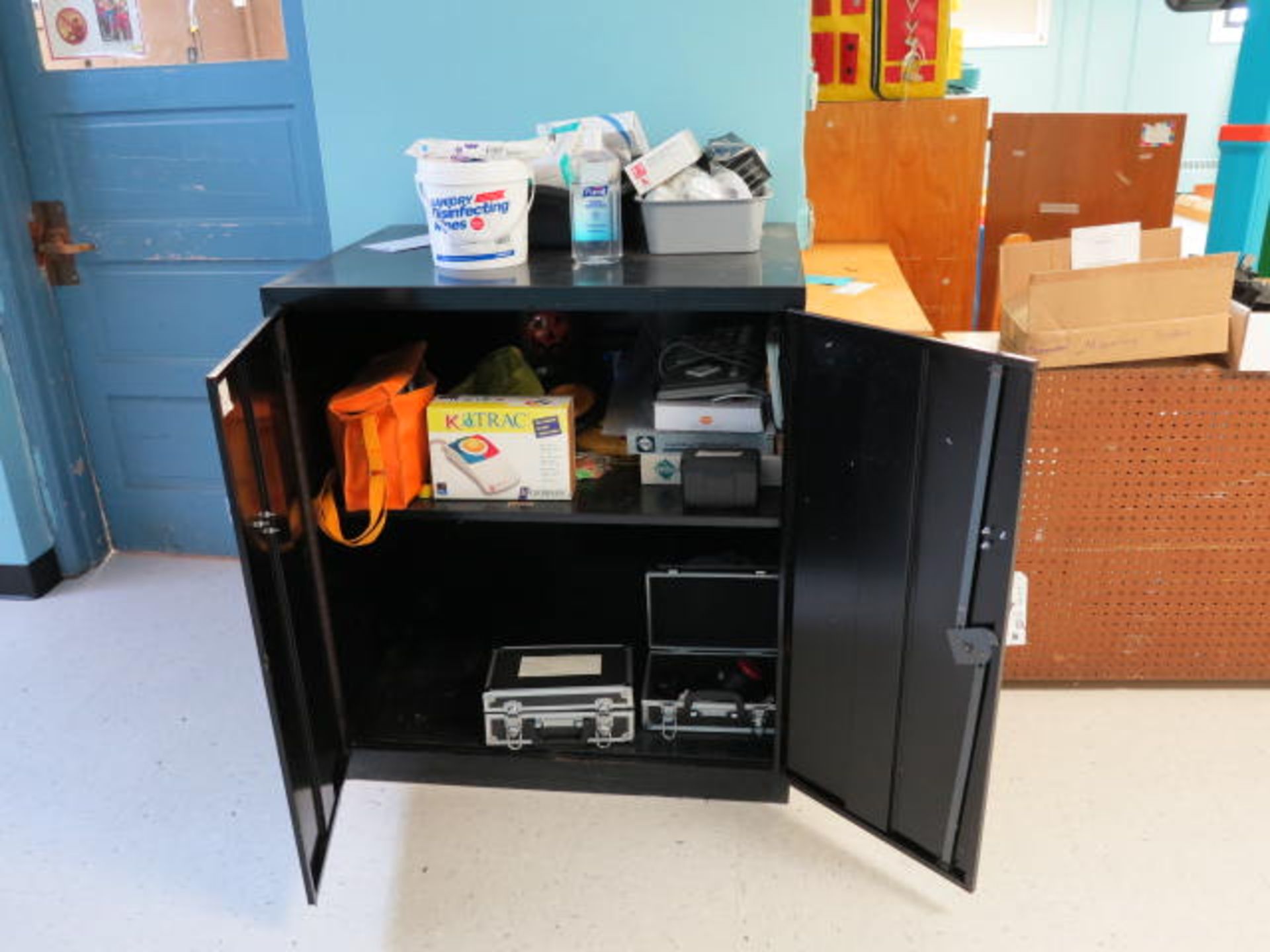 2 Door Cabinet and Contents, PPE Products Located in PT Room