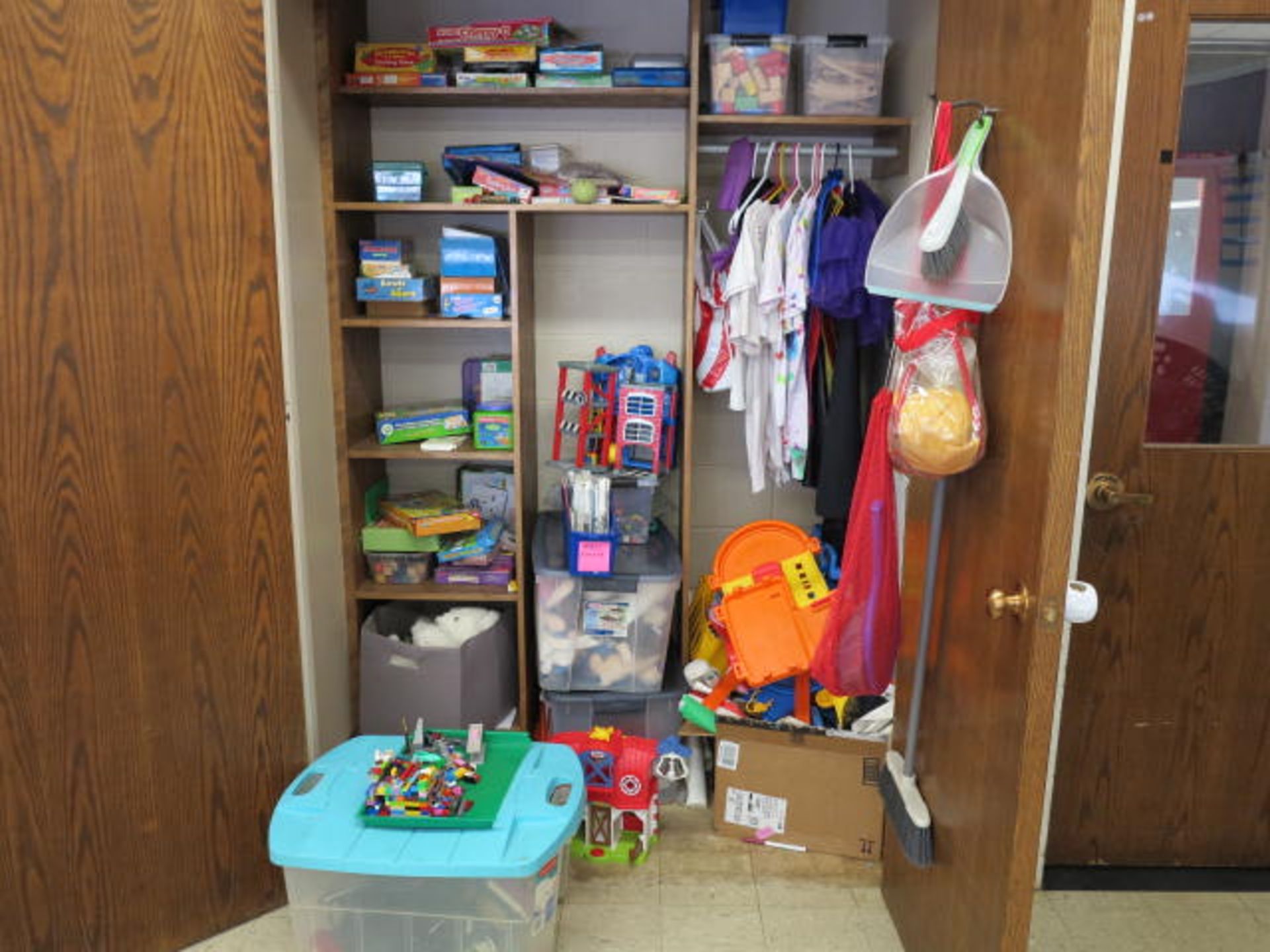 Lot Contents of Closet including Bookshelves and Rug Located in Room 4