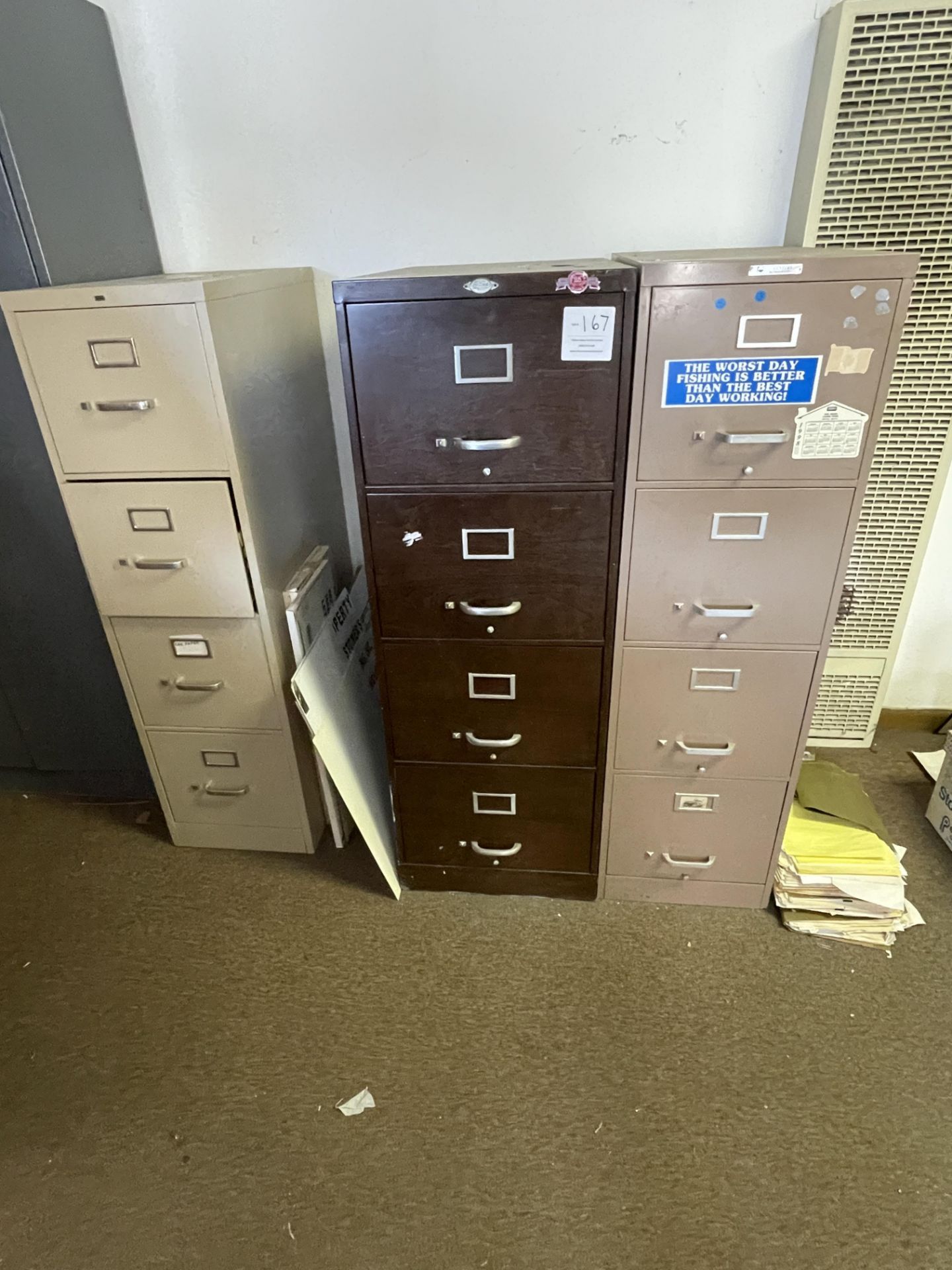 Three metal four drawer filing cabinets