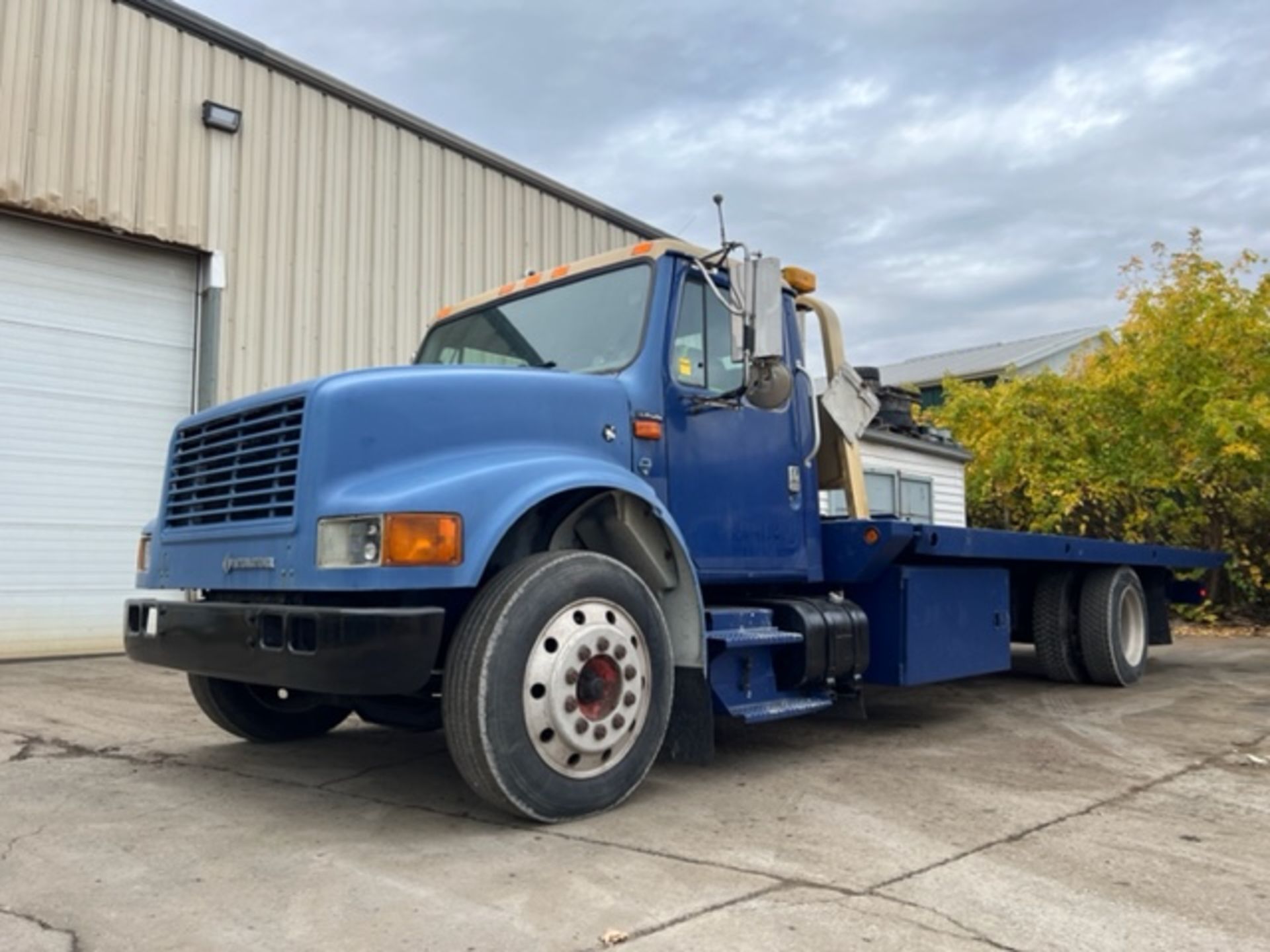 Navistar International Model 40S Flat Bed TILT and LOAD with a winch Transport Truck 2 axle,