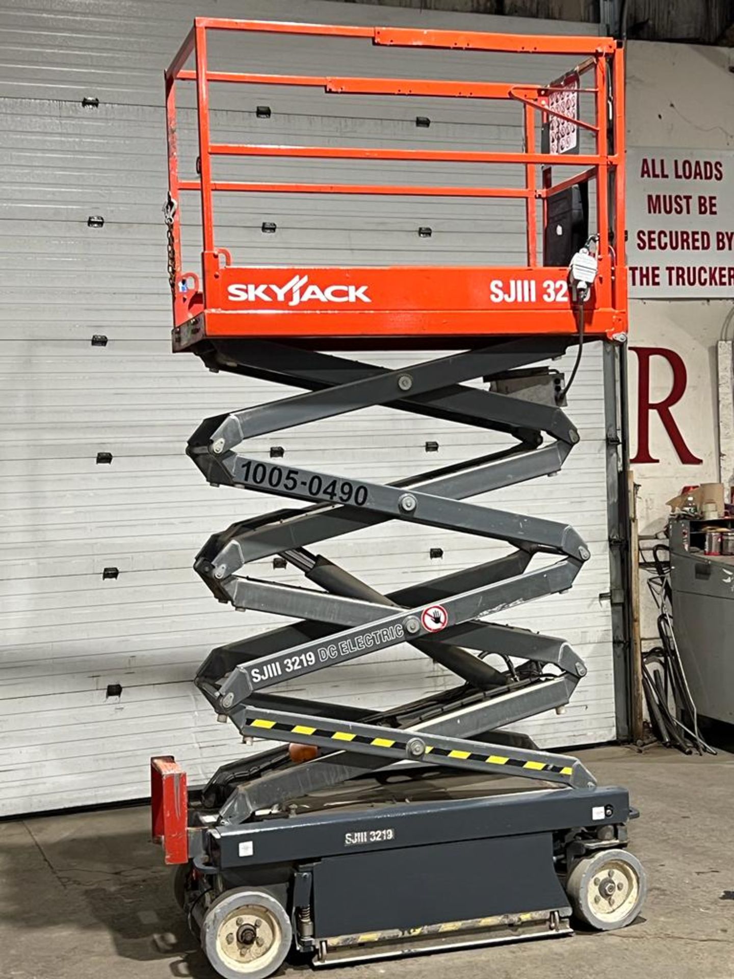 2013 SkyJack III Electric Scissor Lift model 3219 - 19 feet lift, 32 inch width deck with pendant